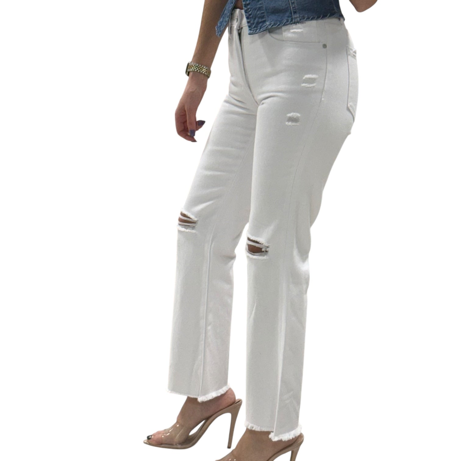 White distressed jeans worn by a person on a white background