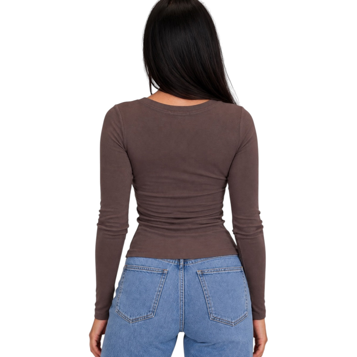 A woman viewed from the back wearing a fitted, long-sleeve brown top and light blue jeans against a plain white background.