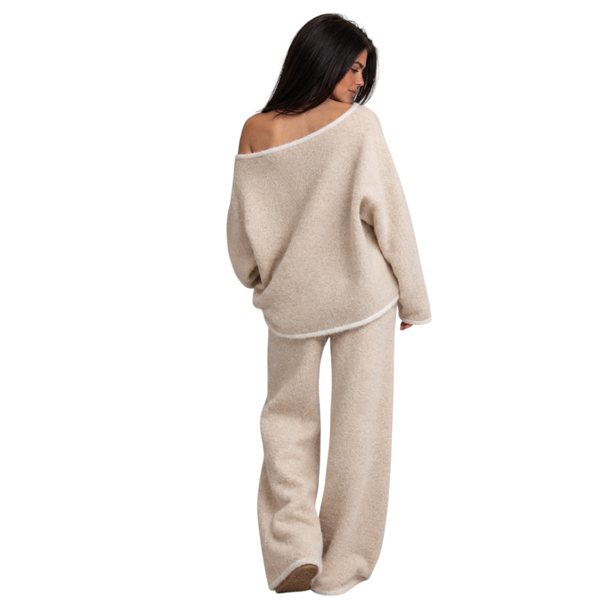 A woman shown from the back wearing a matching fuzzy knit loungewear set in a light beige color, consisting of an off-the-shoulder sweater and wide-leg pants, against a plain white background.