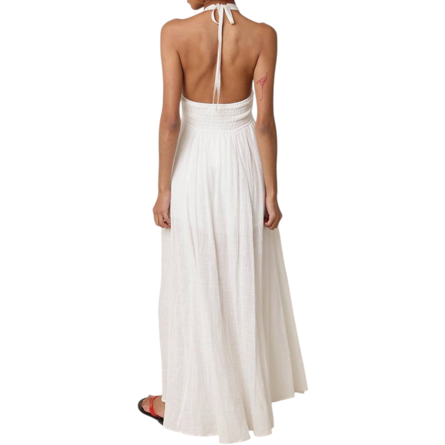 White halter neck dress with open back on a white background