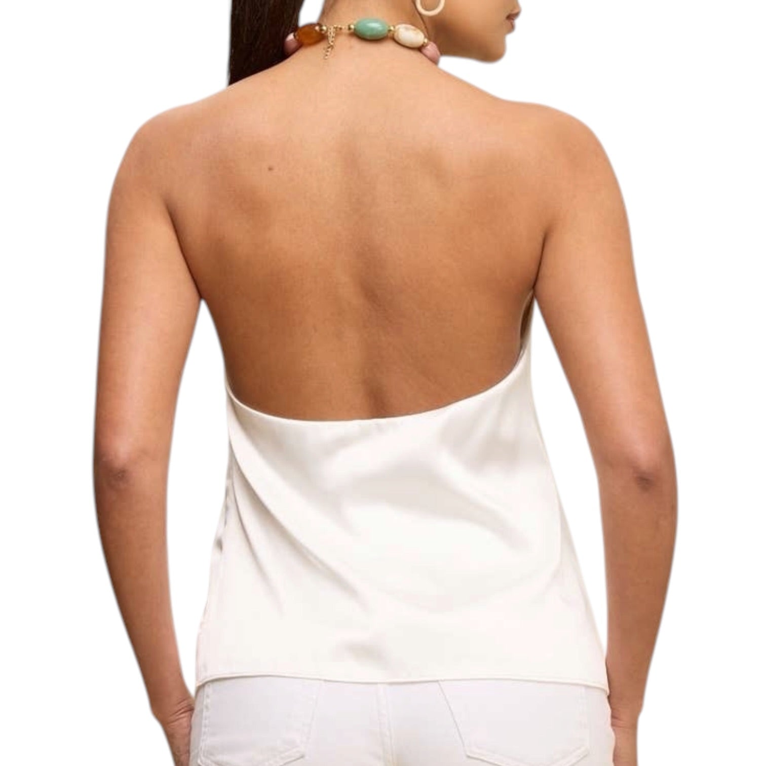 Woman wearing a white halter top on a white background