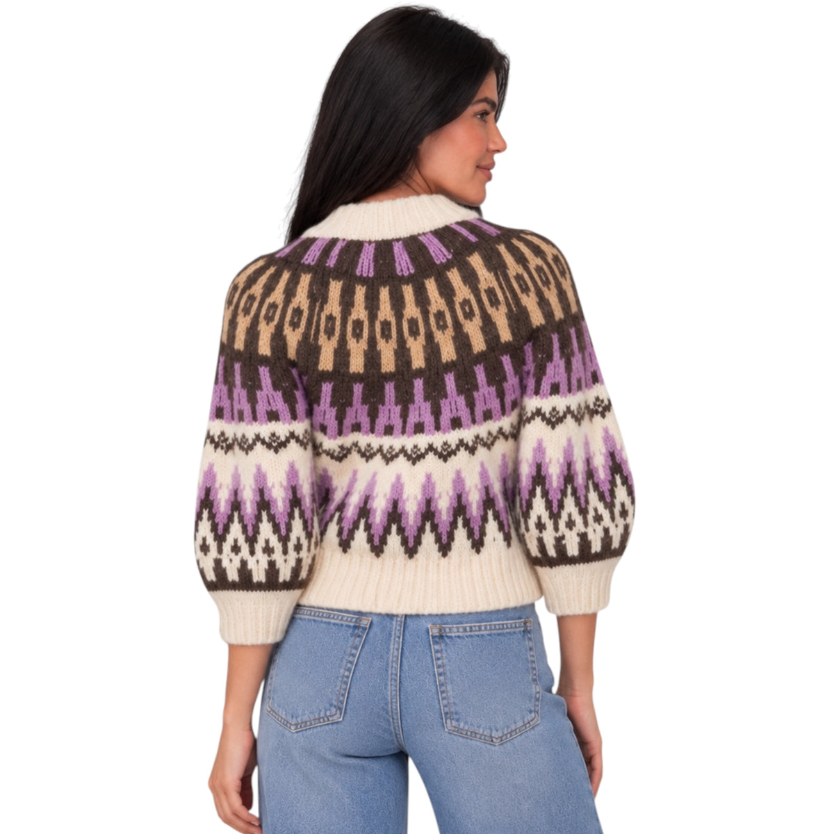 A woman shown from the back wearing a cream, brown, and purple patterned knit sweater with balloon sleeves, paired with light blue jeans, against a plain white background.