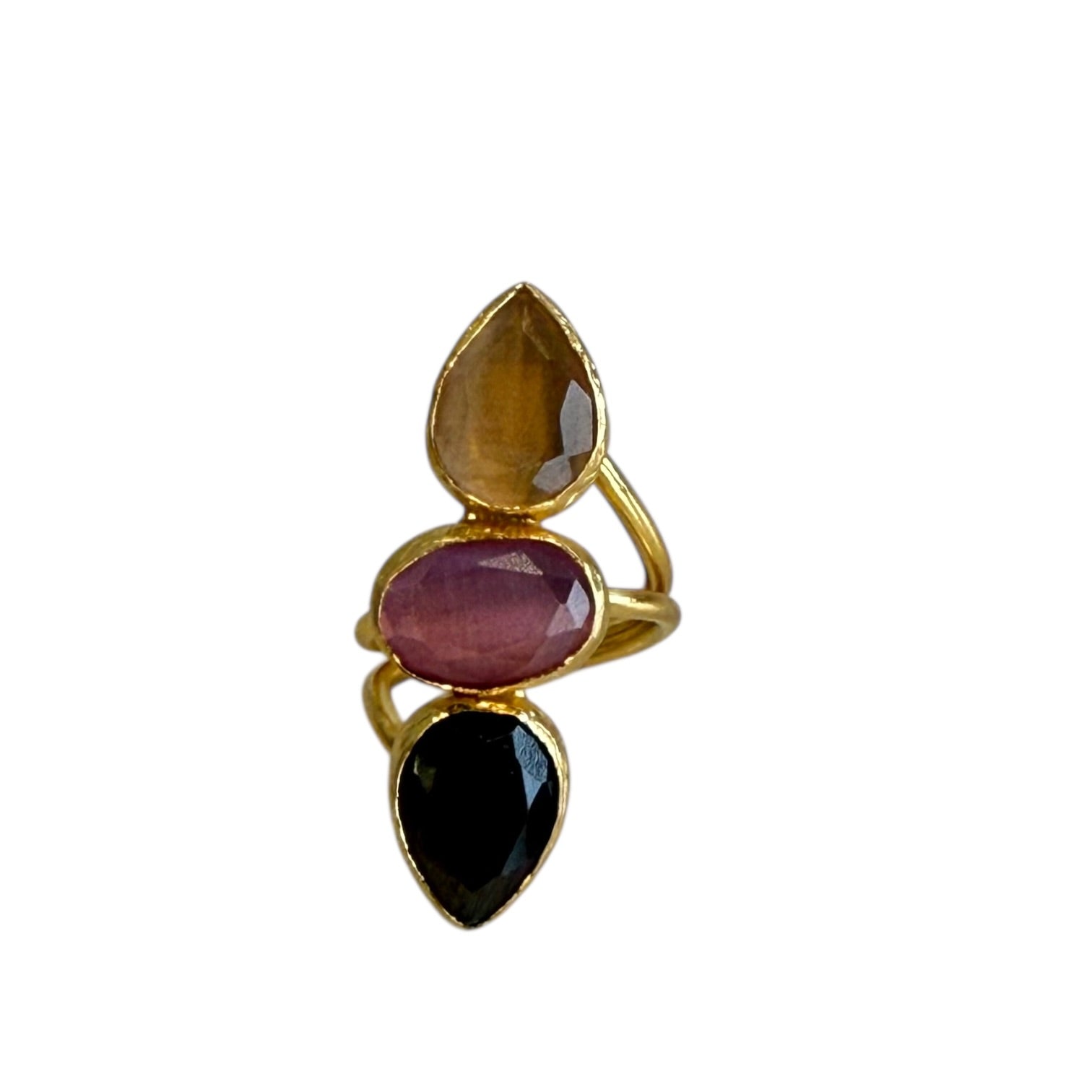Gold ring with three teardrop-shaped gemstones on a white background