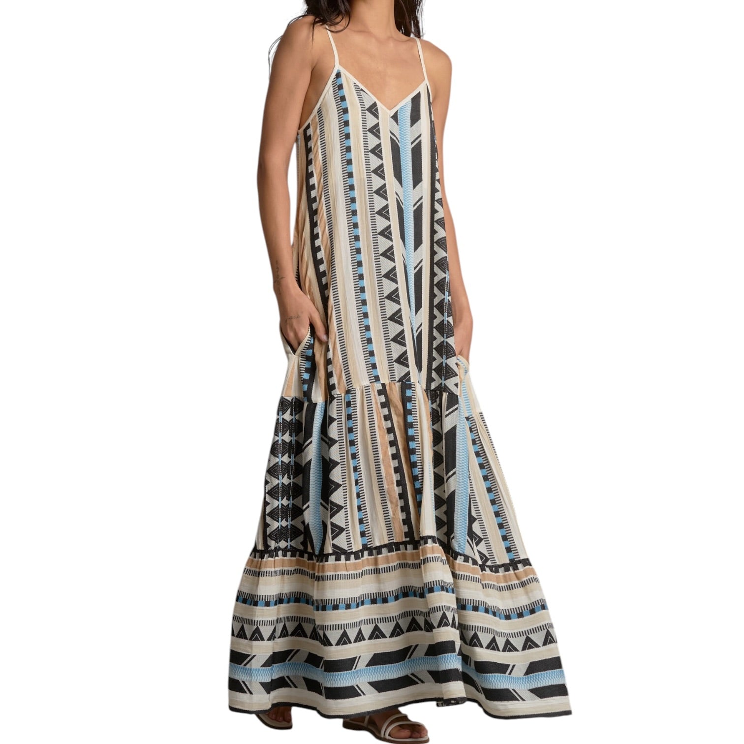 Woman wearing a patterned dress on a white background