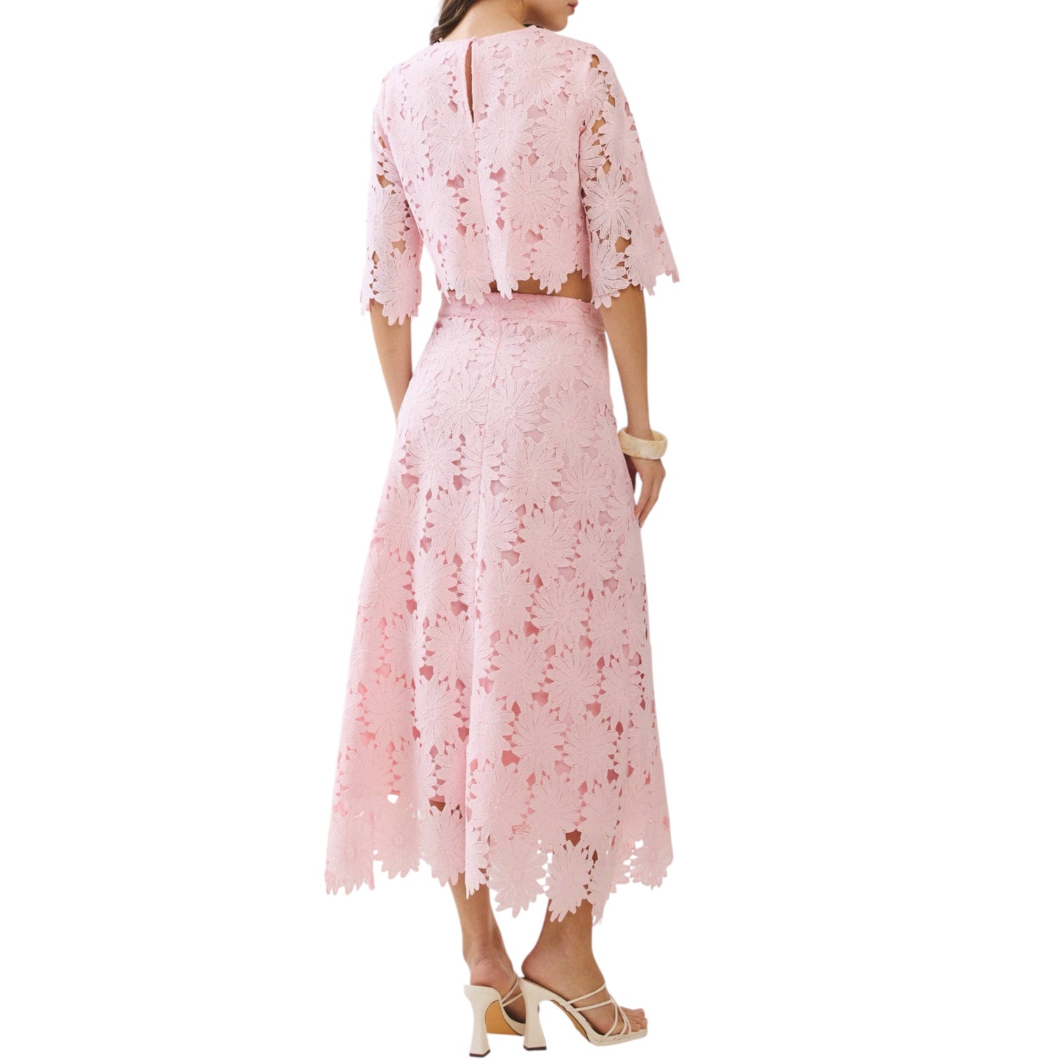 Pink lace dress with a matching jacket on a white background
