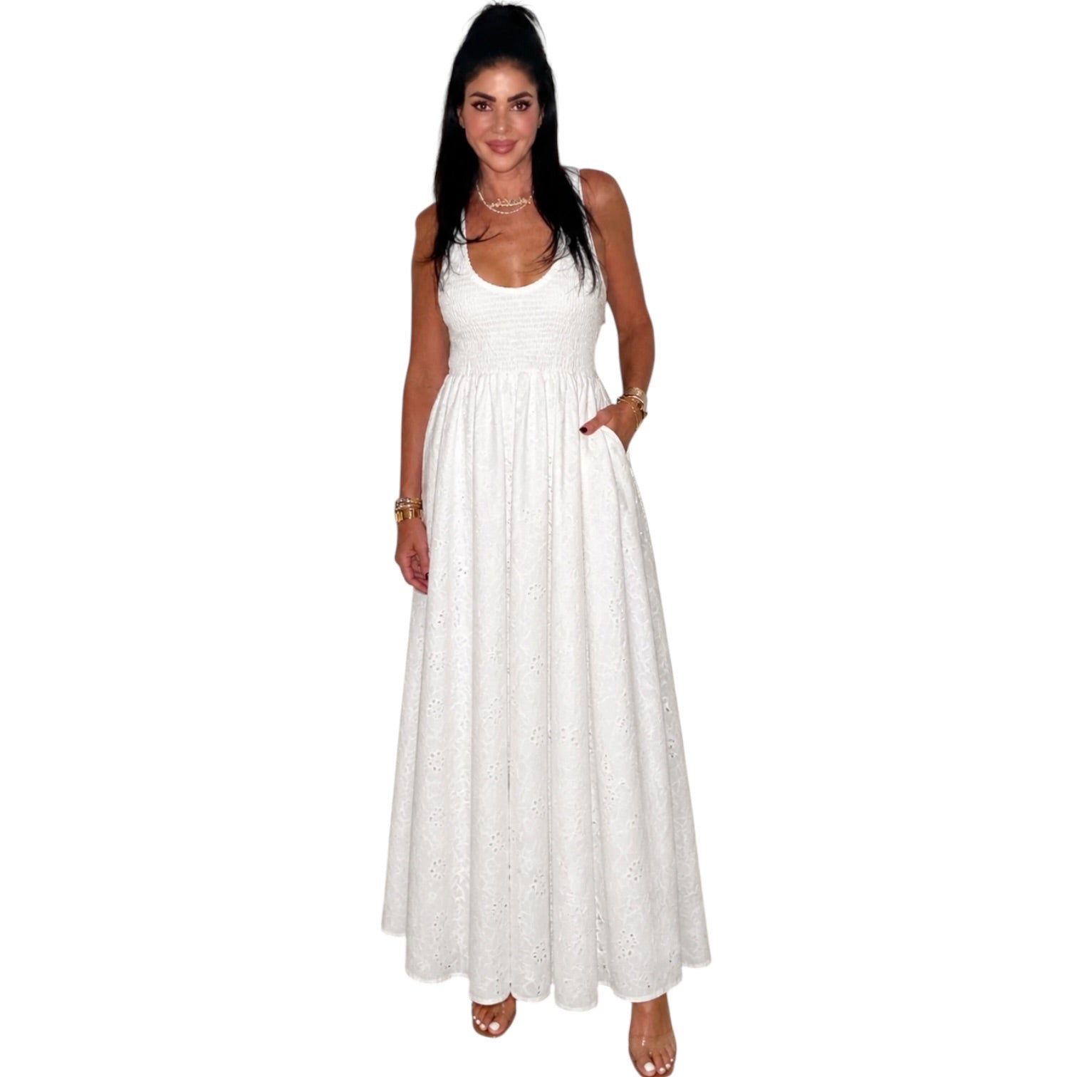 Woman wearing a white sleeveless dress on a white background