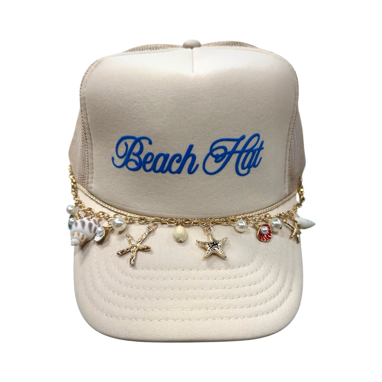 Beige cap with 'Beach Hut' text and various charms on a white background