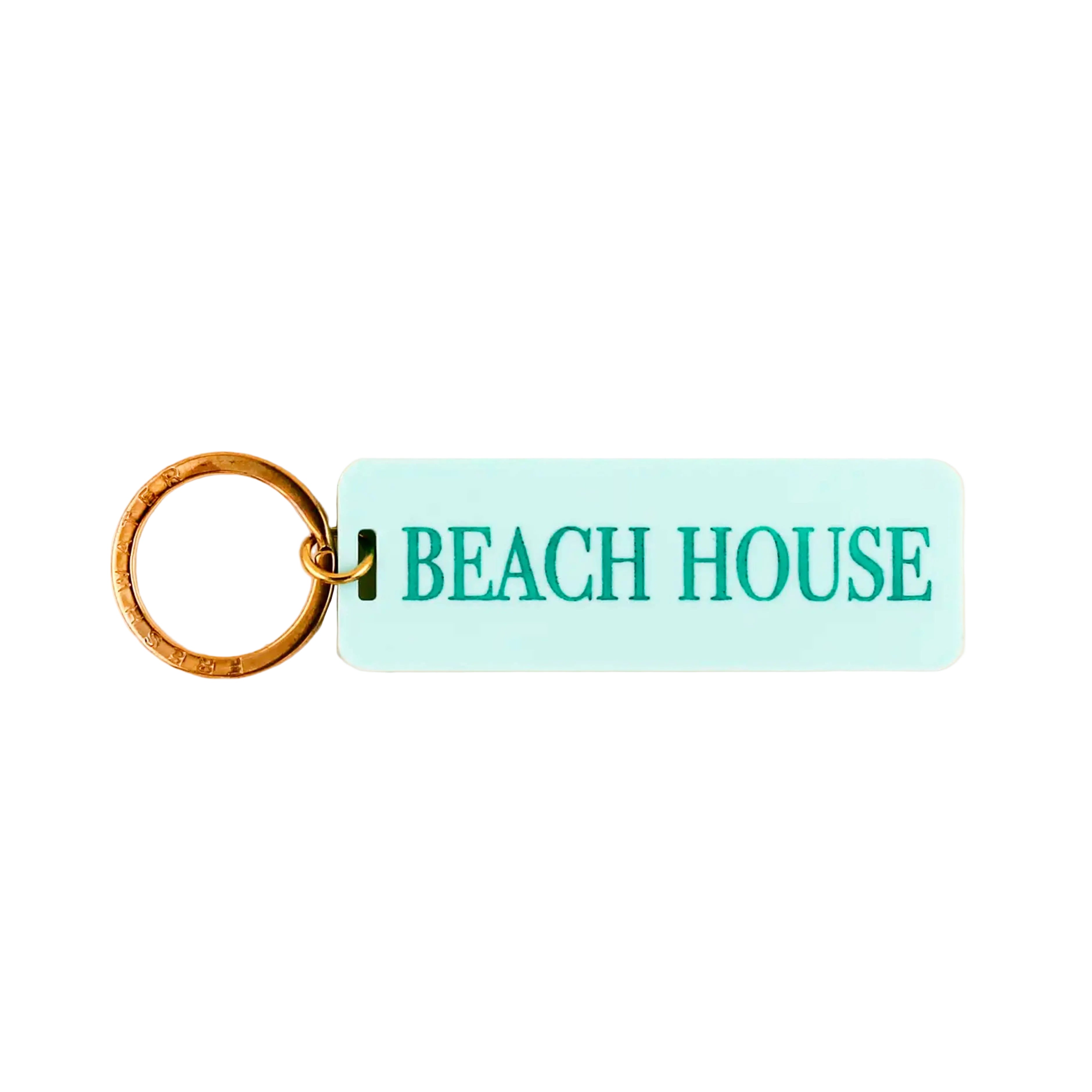 Keychain with 'BEACH HOUSE' text on a light blue rectangular tag against a white background