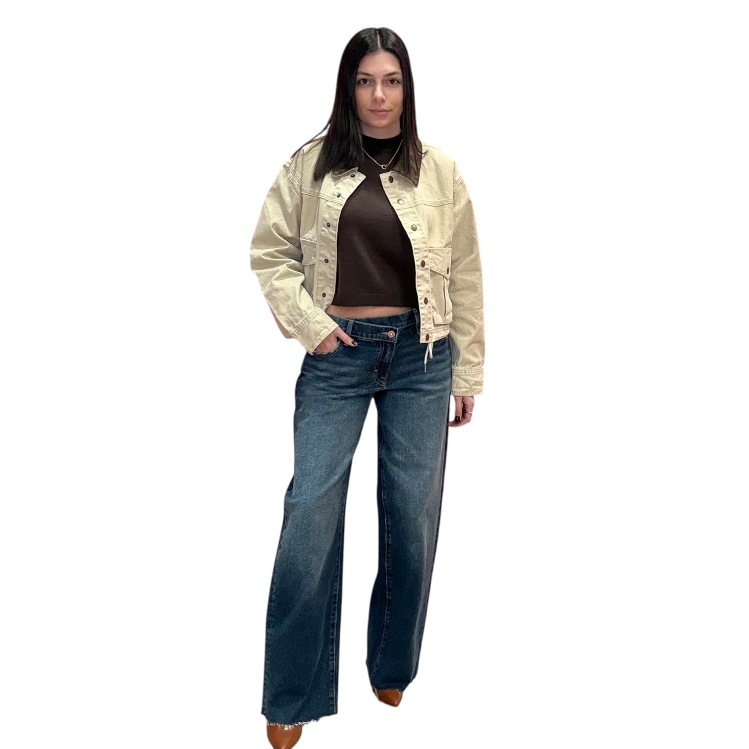 Woman wearing a beige jacket and blue jeans on a white background