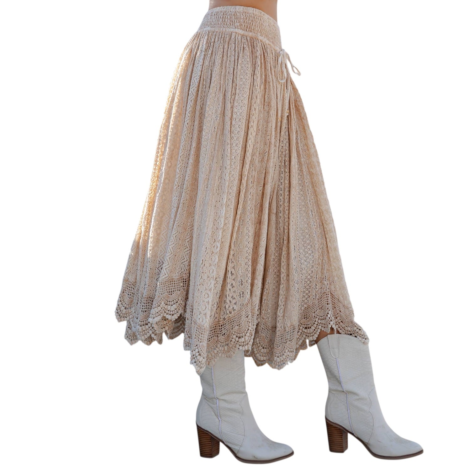 Beige lace skirt with white boots on a white background