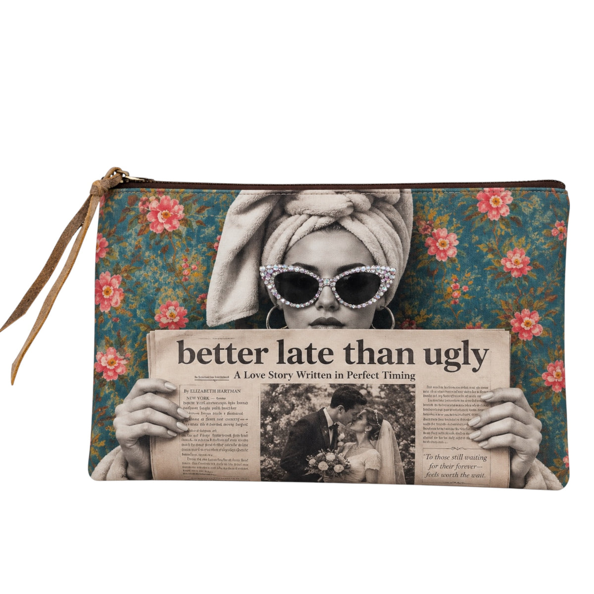 A zippered clutch bag with a vintage-style graphic print of a woman in a towel headwrap and sunglasses holding a newspaper, set against a teal floral background. The bag has a tan leather zipper pull and is shown on a plain white background.
