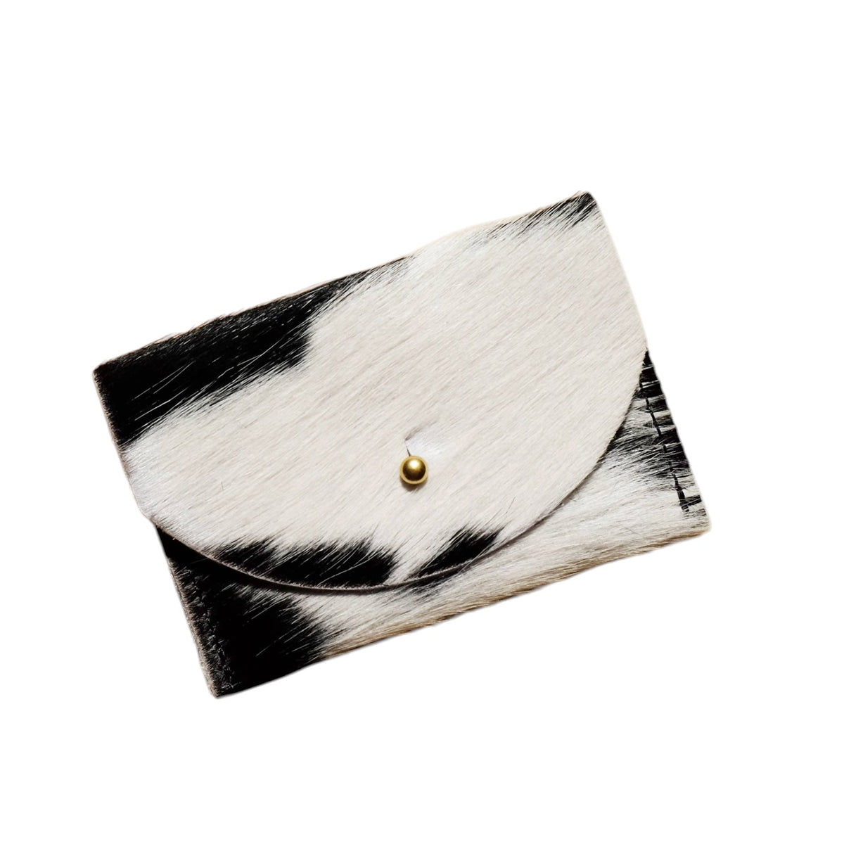 A small black and white cowhide cardholder with a gold snap button, shown on a plain white background.