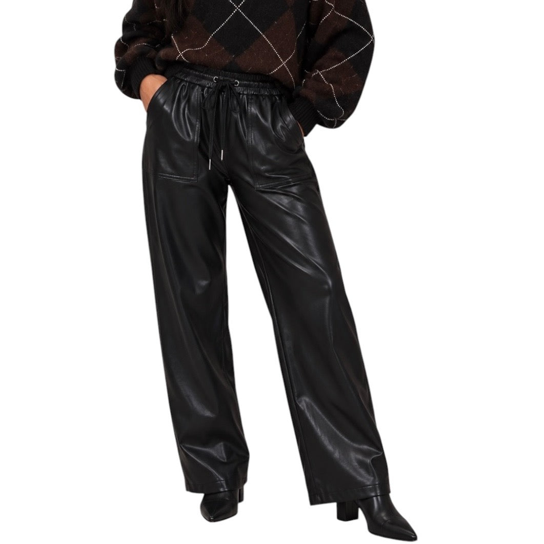 Black faux leather wide-leg pants with a drawstring waist, modeled with a dark argyle sweater and black pointed-toe heels against a white background.