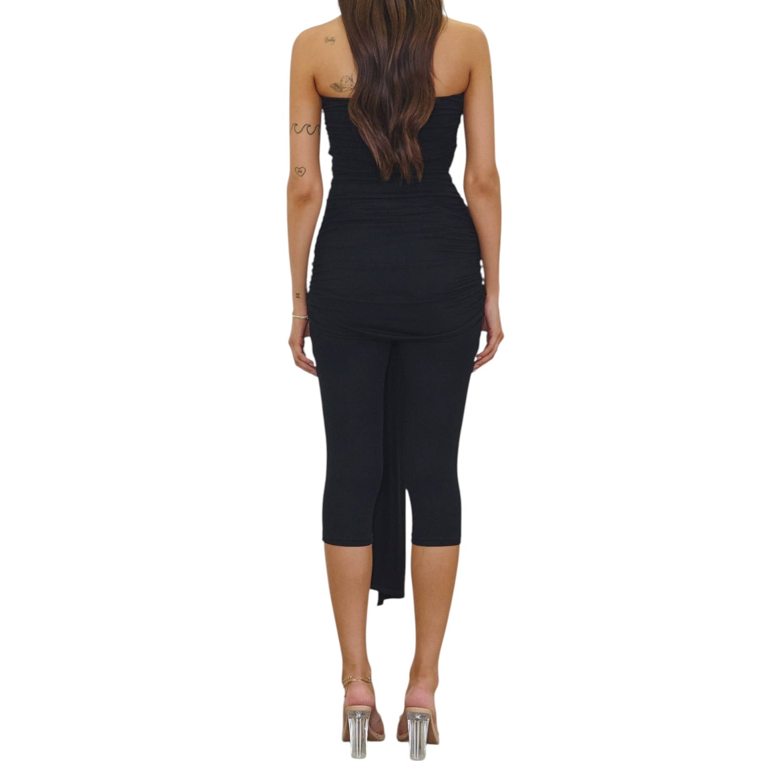 Black jumpsuit worn by a person on a white background