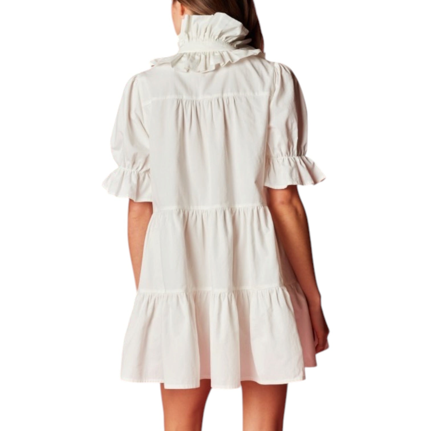 White dress with ruffled collar and sleeves on a white background