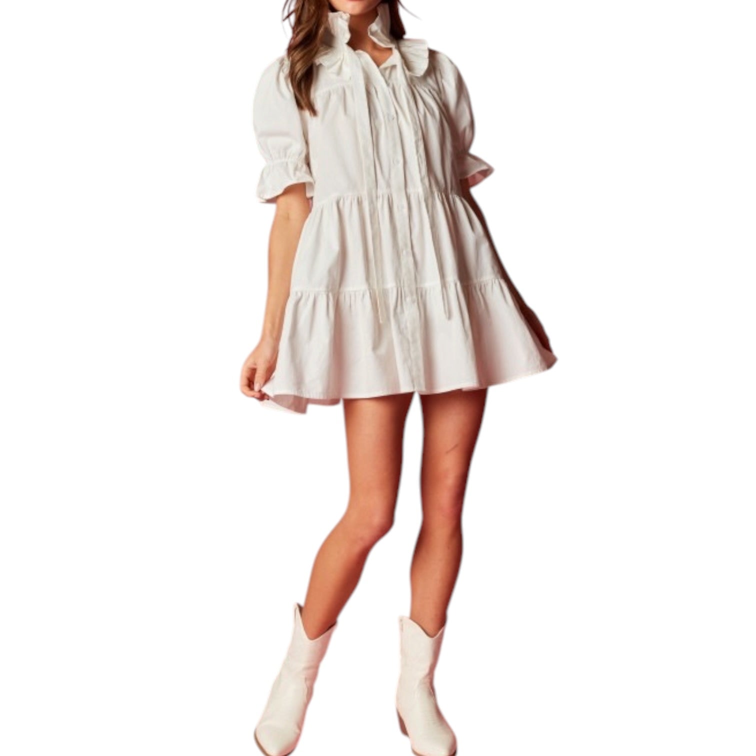 Woman wearing a white dress and boots on a white background