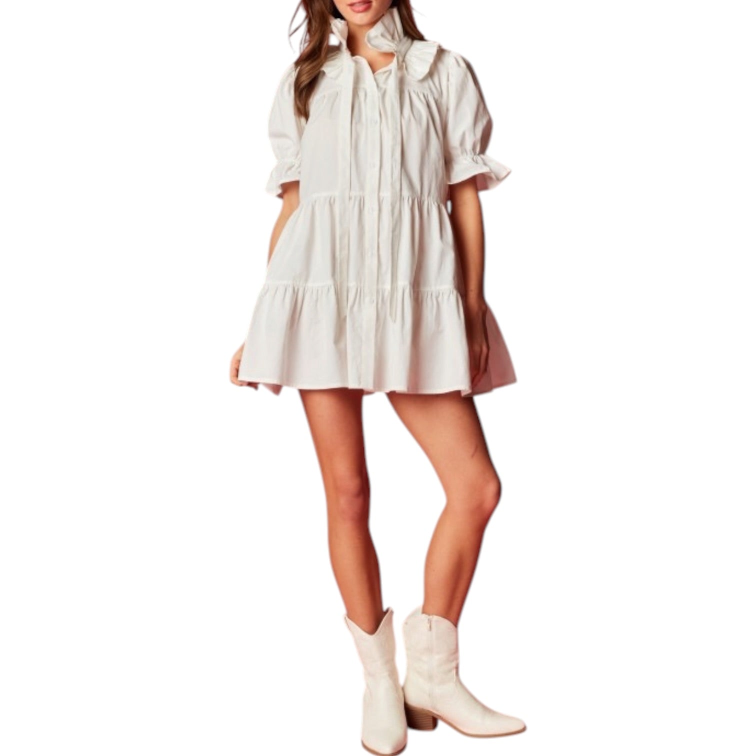 Woman wearing a white dress and matching white boots on a white background