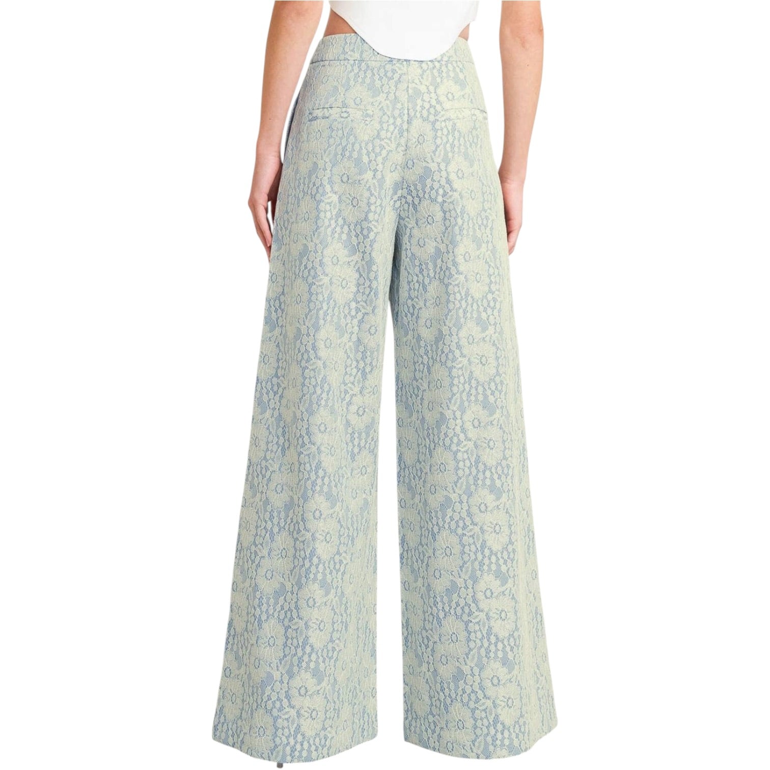 woman wearing floral lace pants with white background
