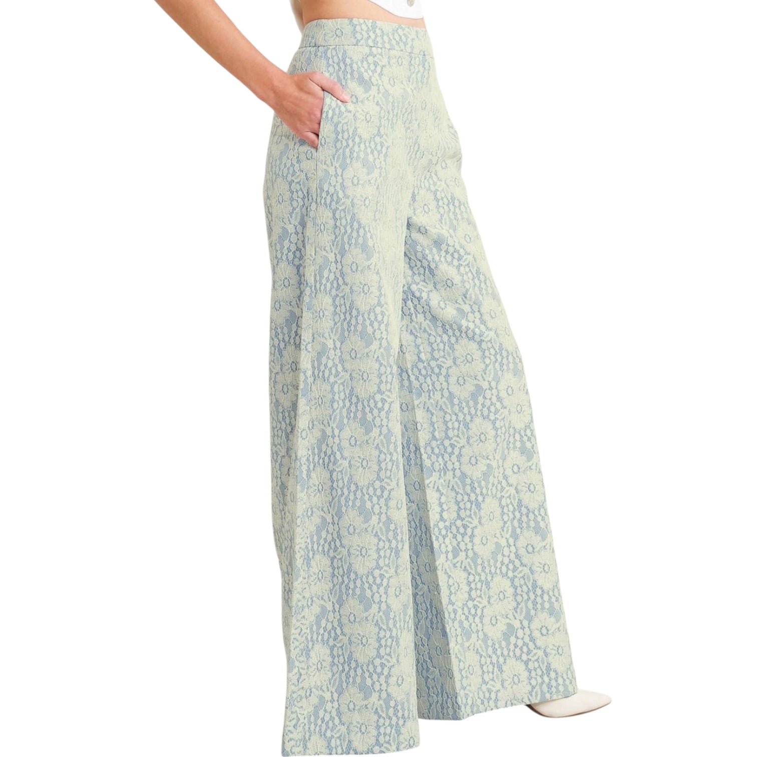 woman wearing floral lace pants with white background