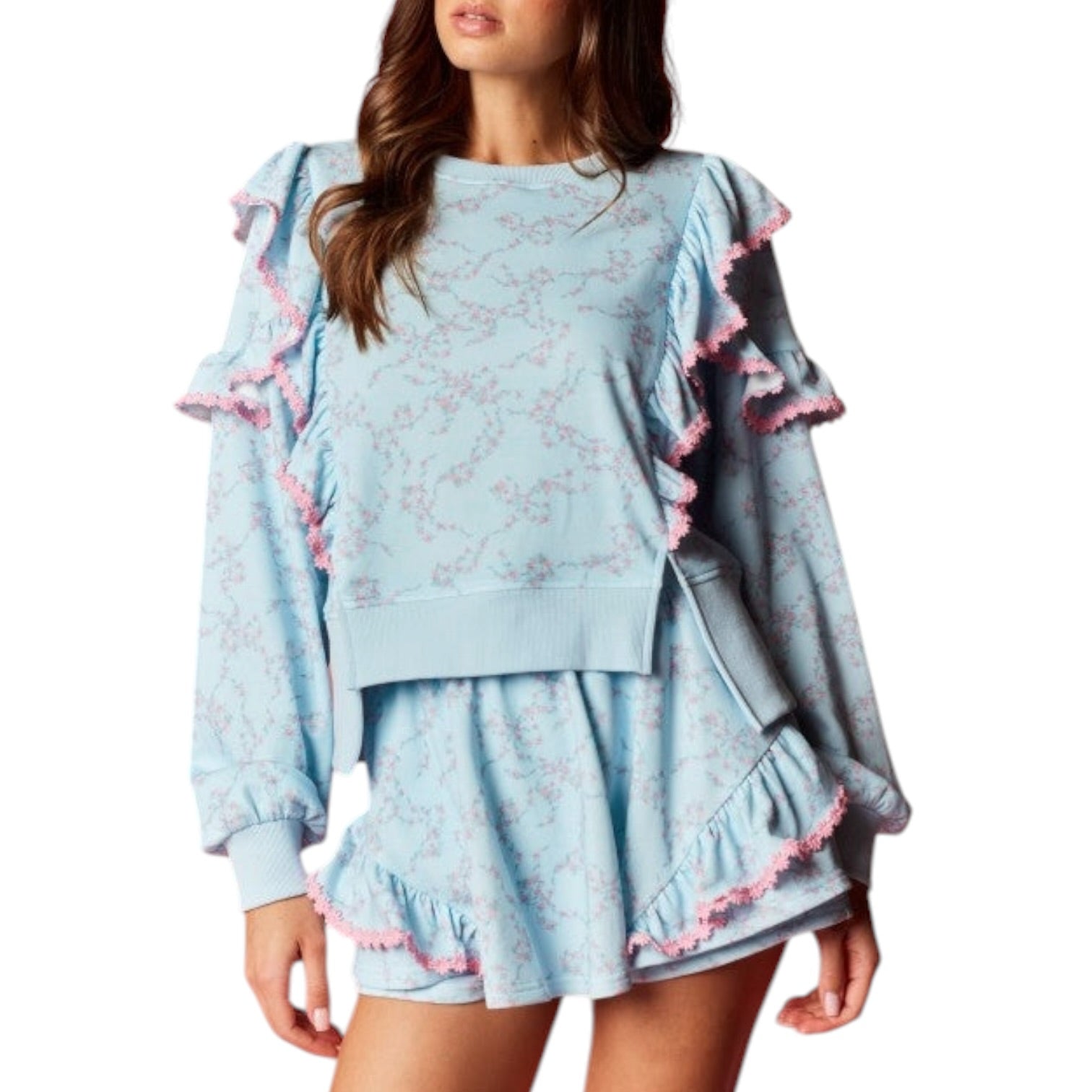 Light blue lounge set with ruffled details on a white background