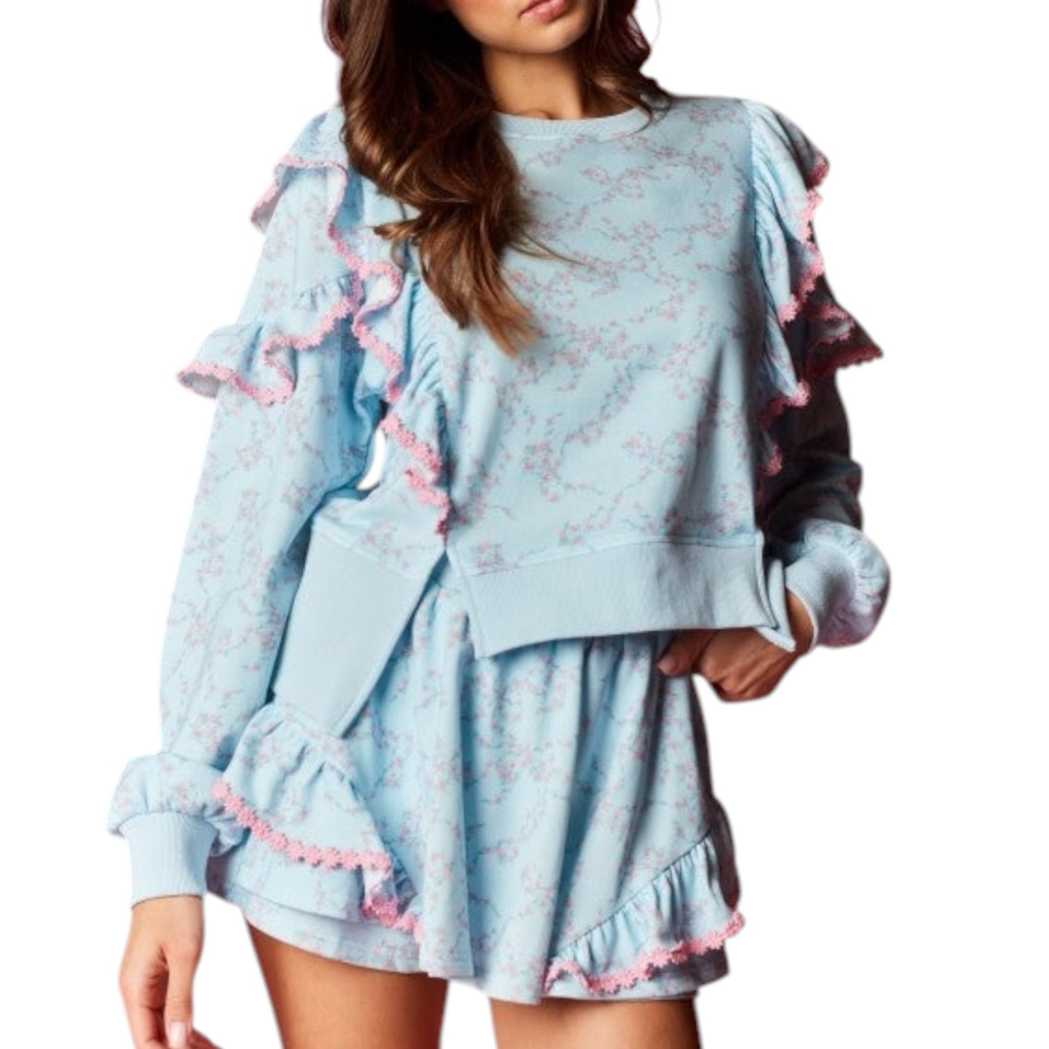 Light blue lounge set with ruffled details on a white background