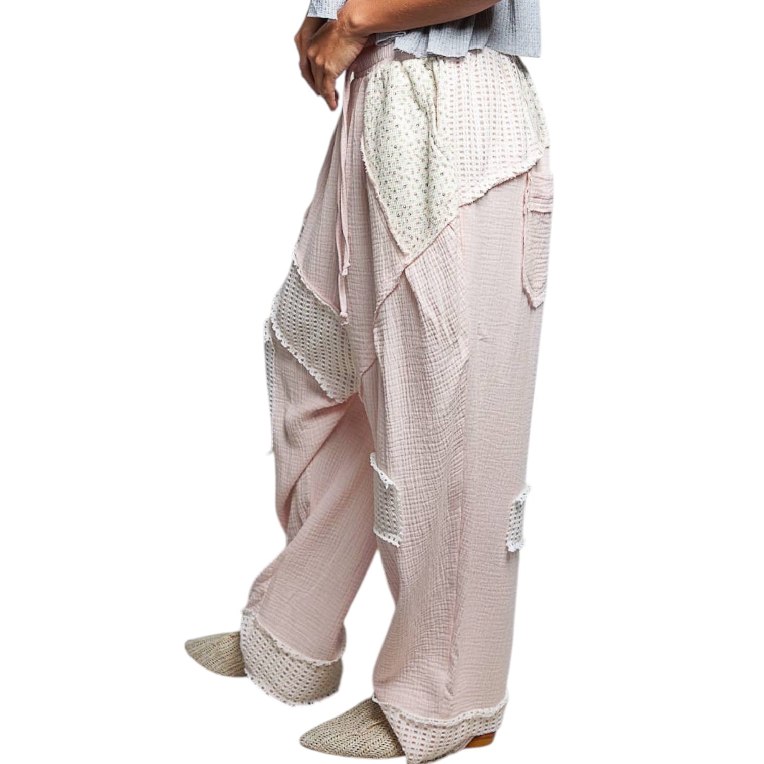 pink and Beige wide-leg pants with a textured pattern on a white background