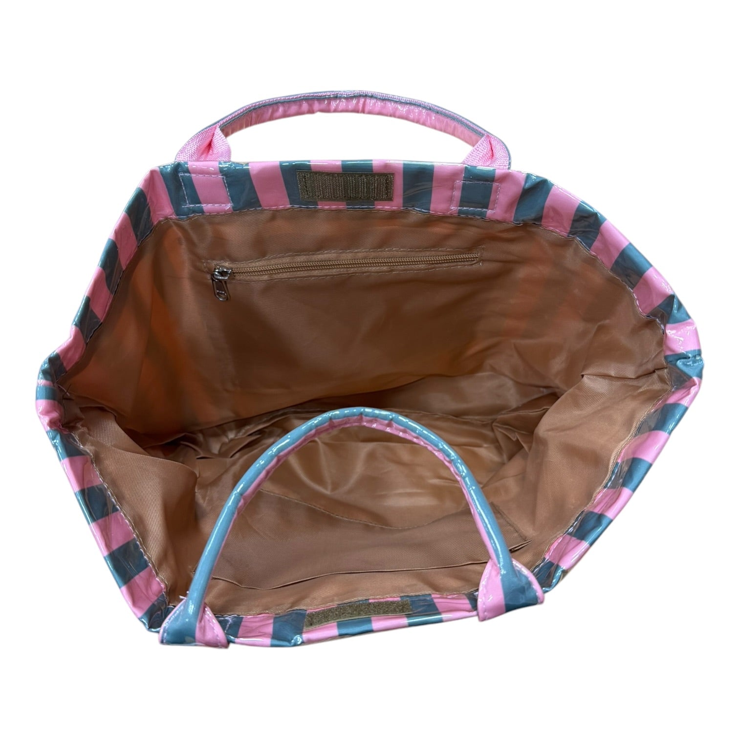 Open handbag with pink and blue checkered exterior and brown interior on a white background