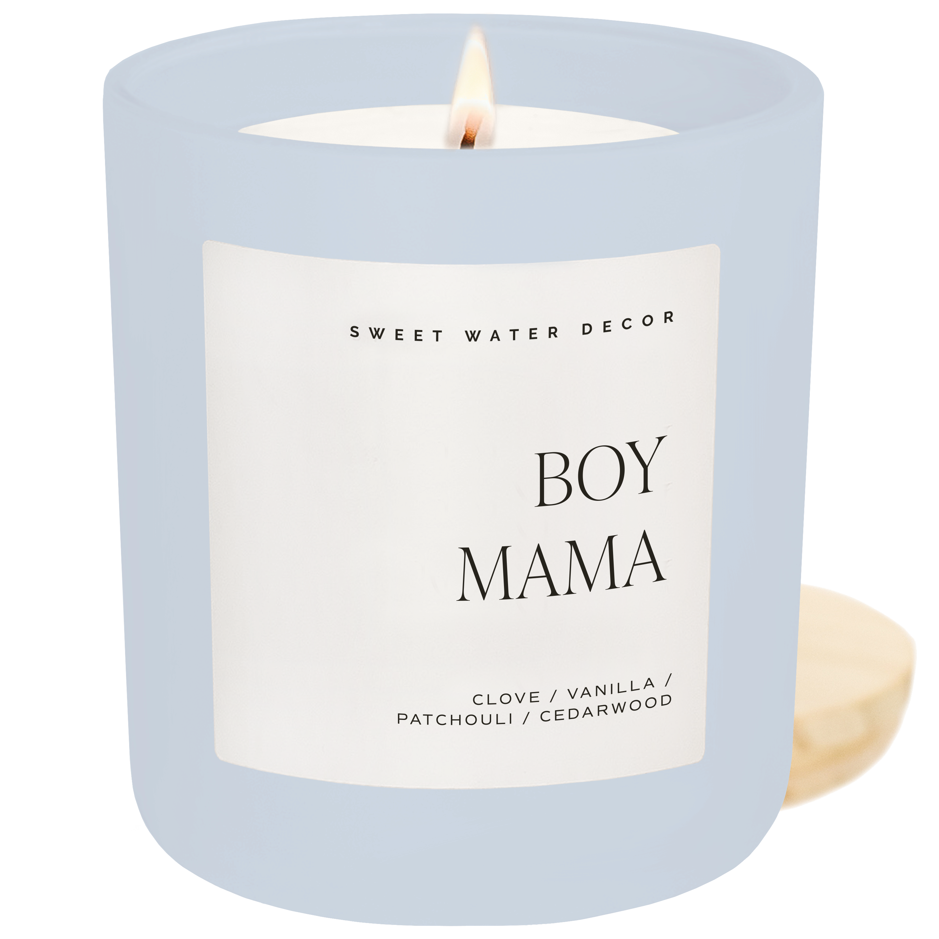 Candle with a label reading 'Boy Mama' by Sweet Water Decor on a white background