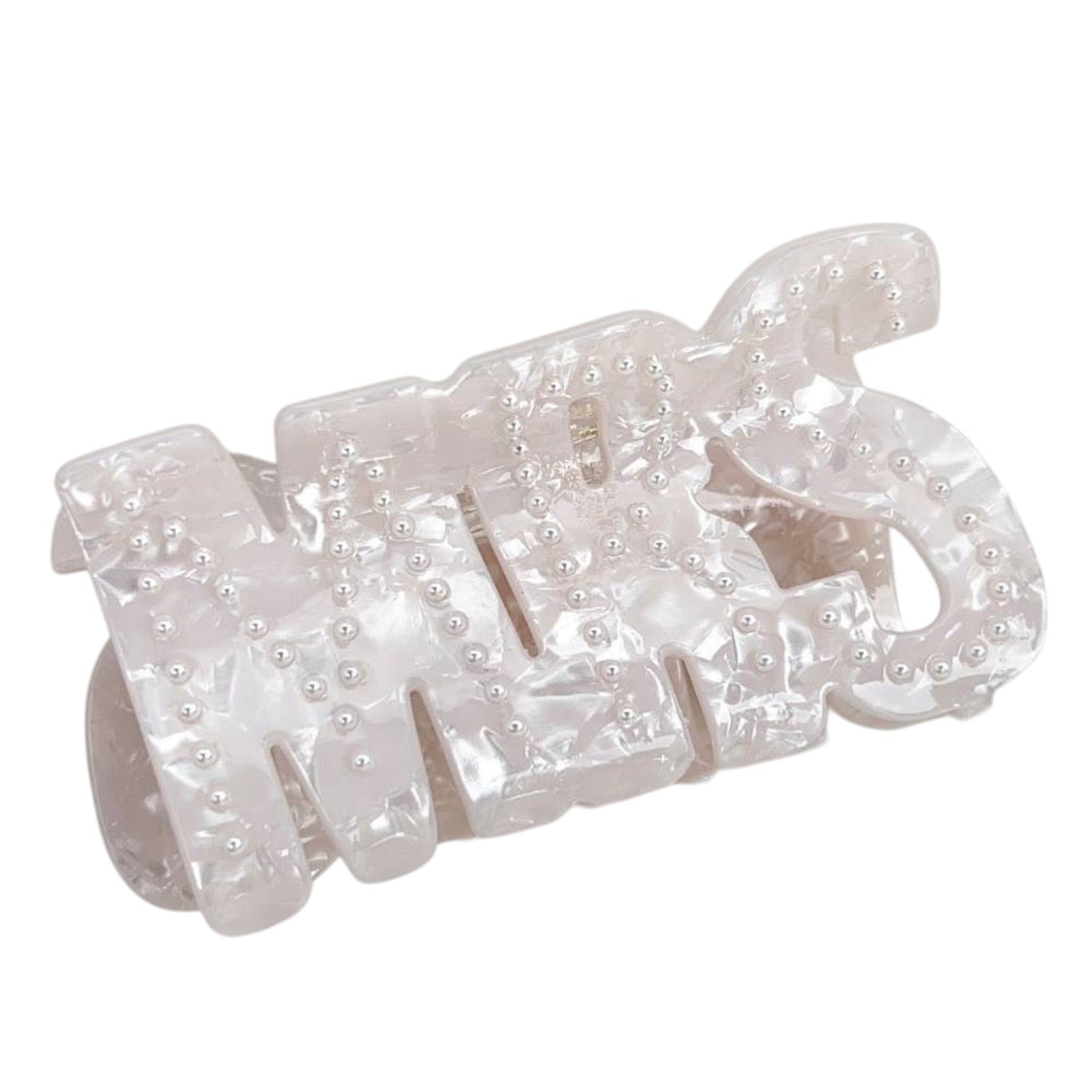 Set of pearl embellished hair clips on a white background