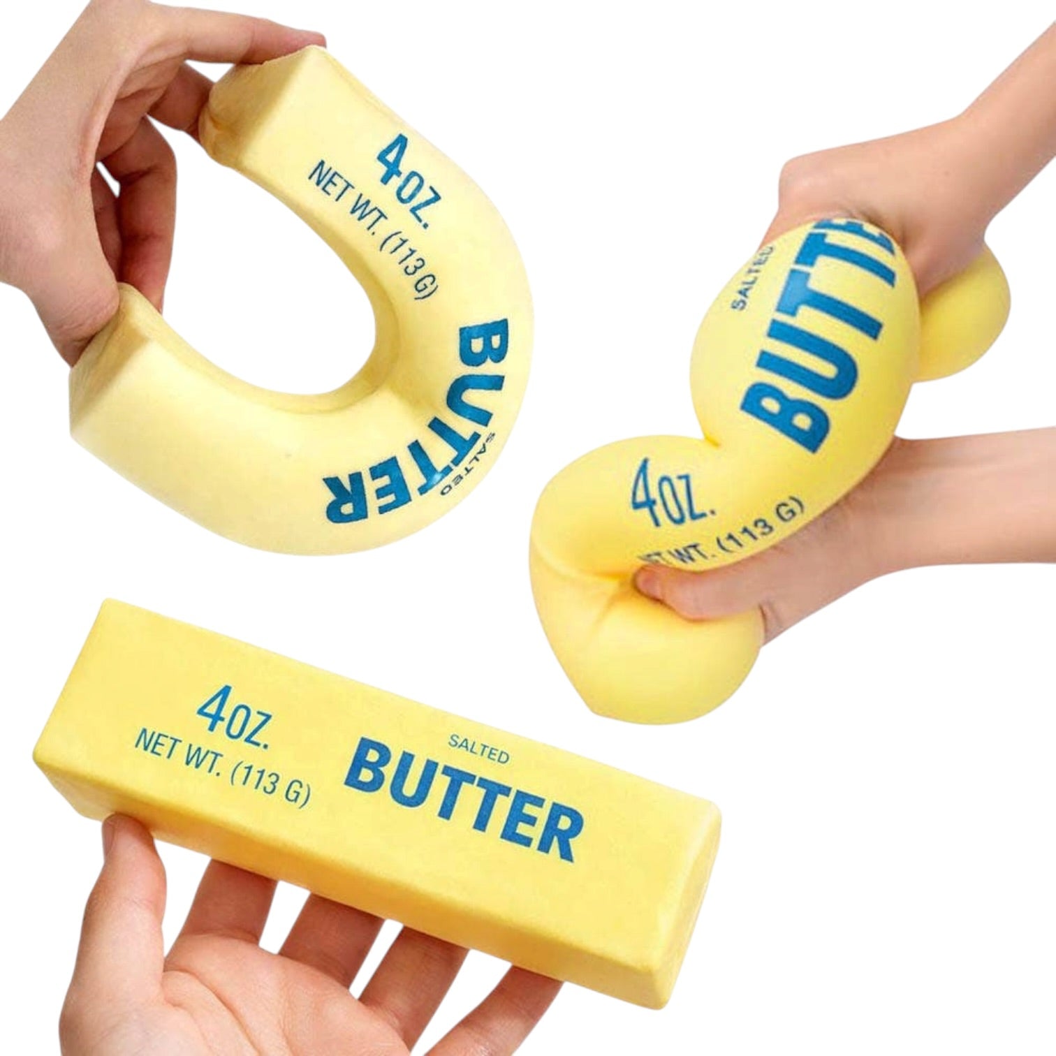 Yellow butter molds held by hands on a white background