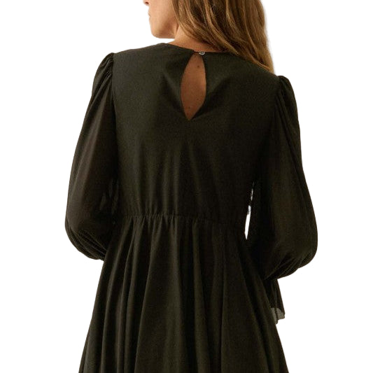 Black romper with long sleeves and open back on white background