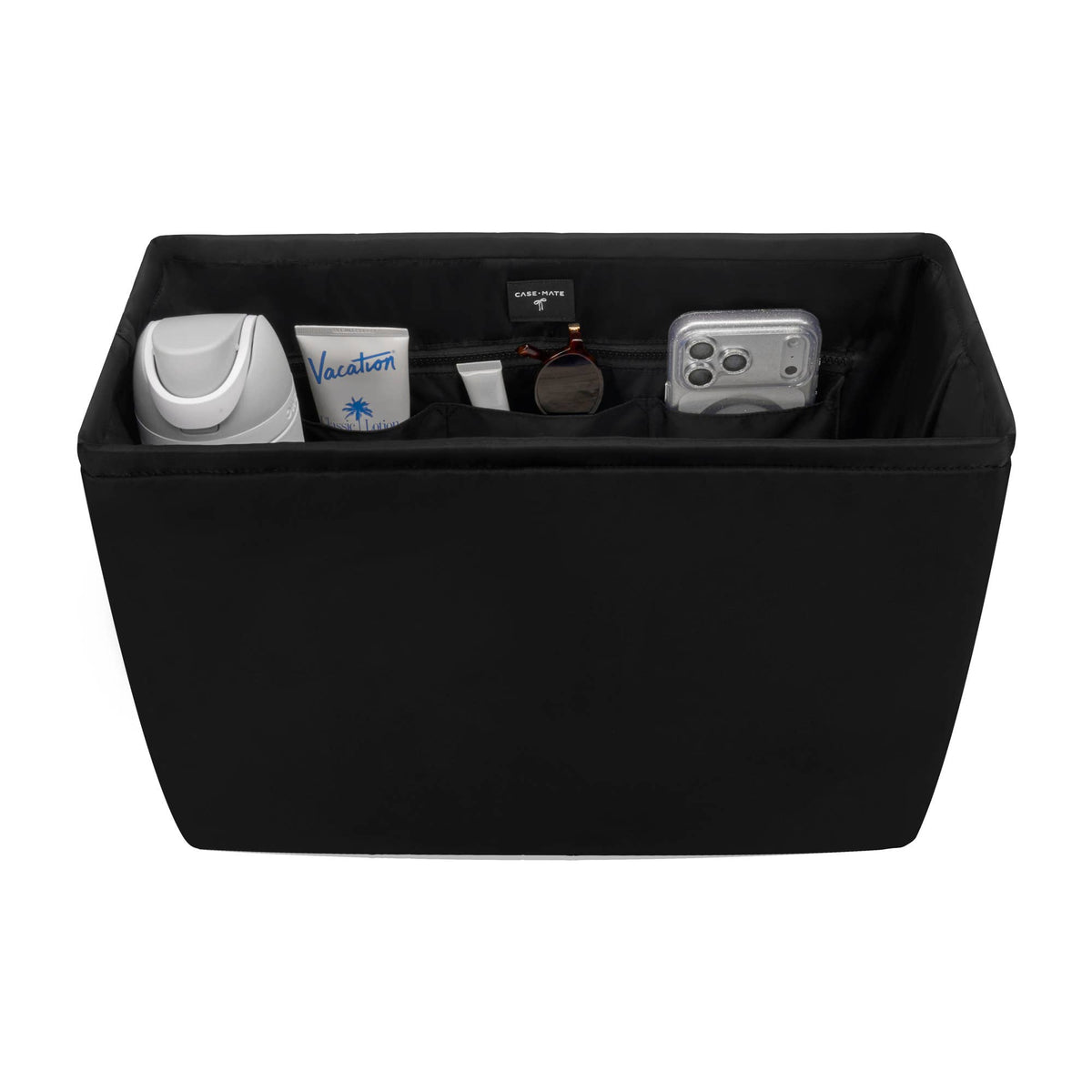 A black fabric storage organizer box with multiple interior compartments holding travel-sized items, shown on a plain white background.
