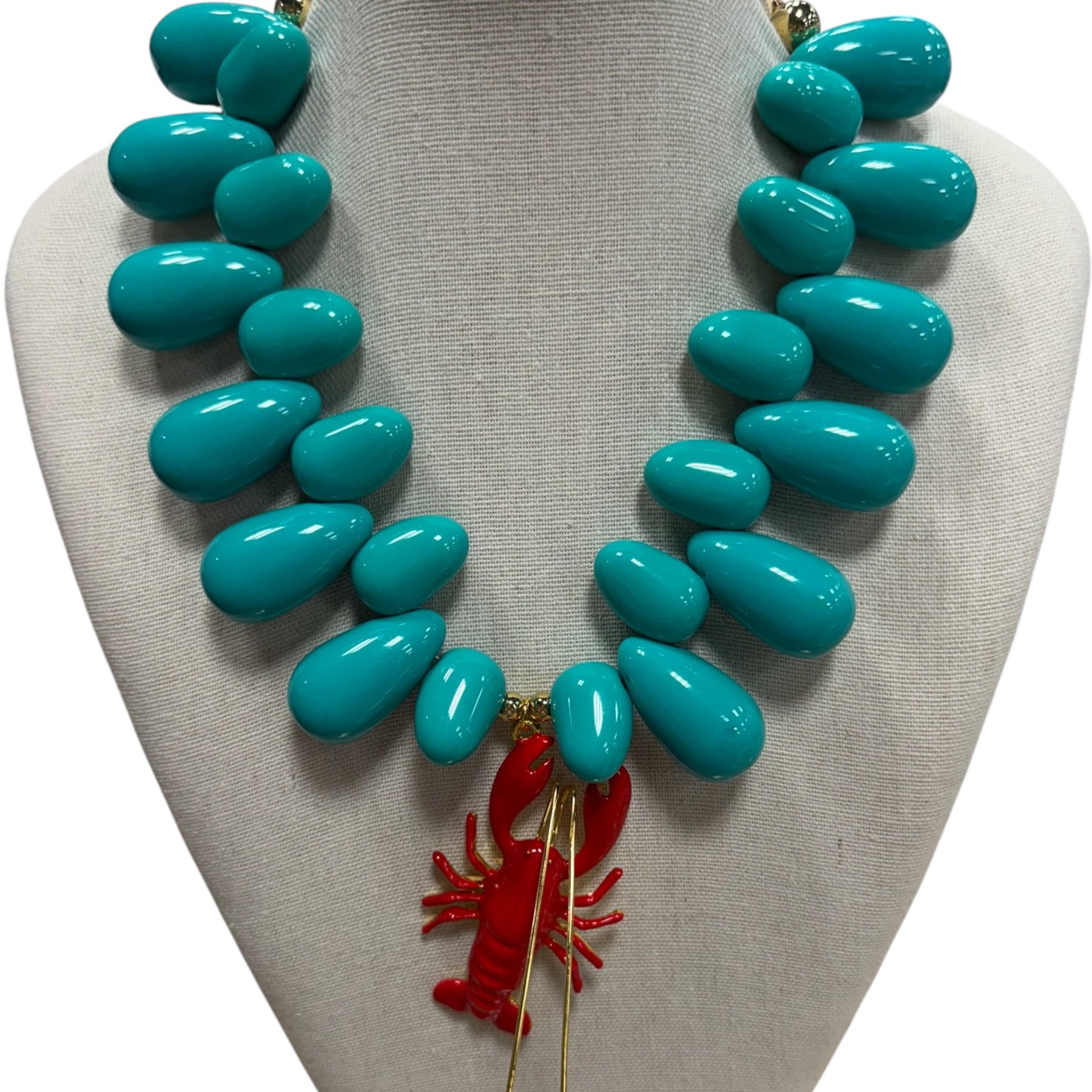 resin beaded necklace with lobster on white background.