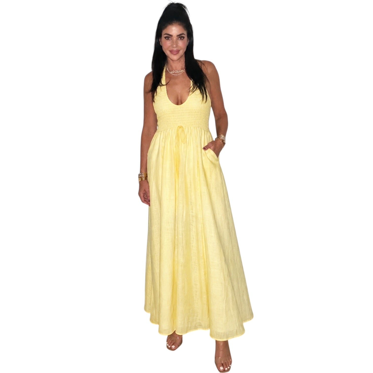 Woman wearing a yellow dress on a white background