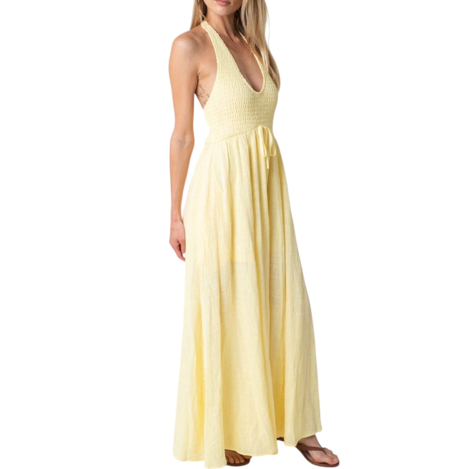 Yellow halter neck dress on a white background
