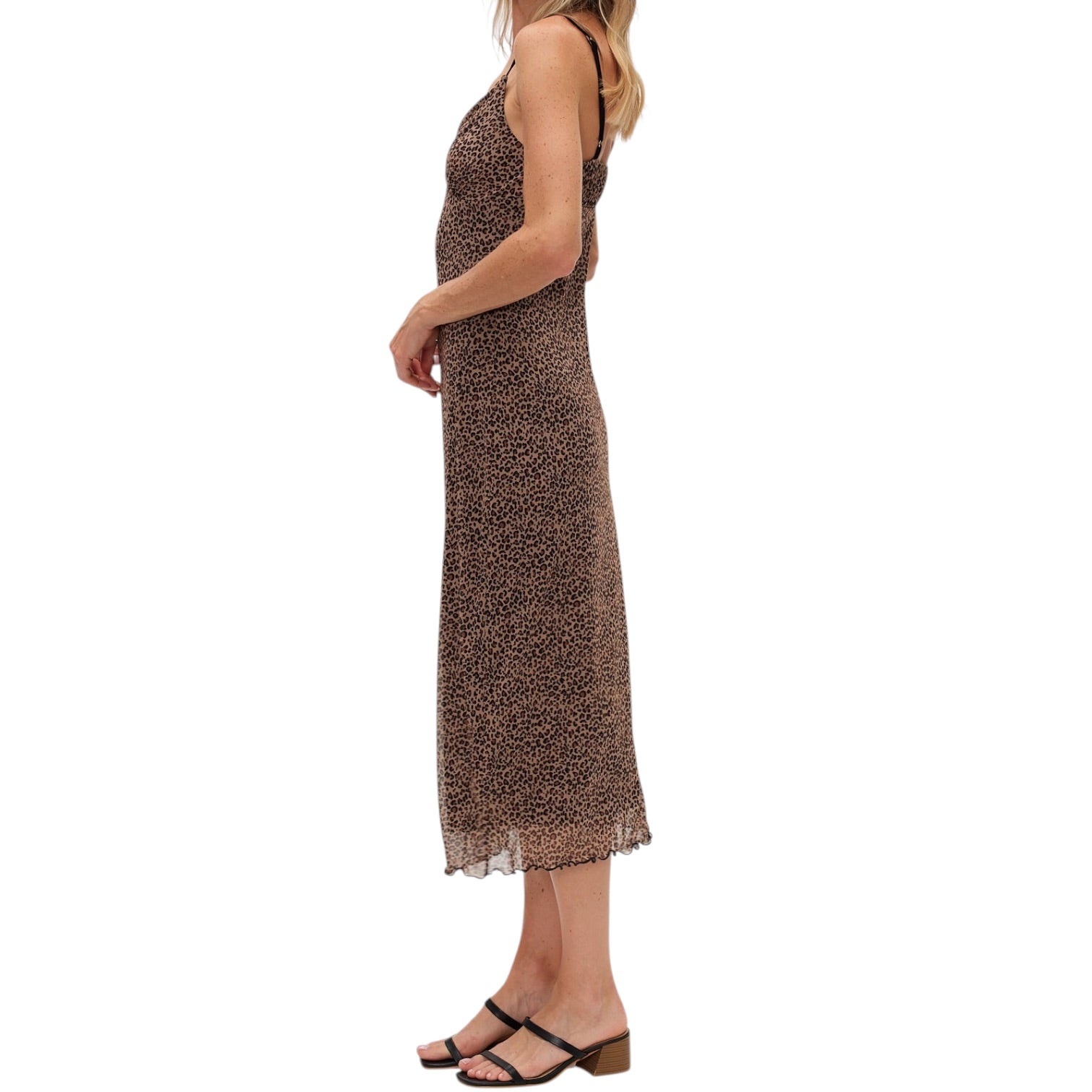 Woman wearing a brown patterned dress on a white background