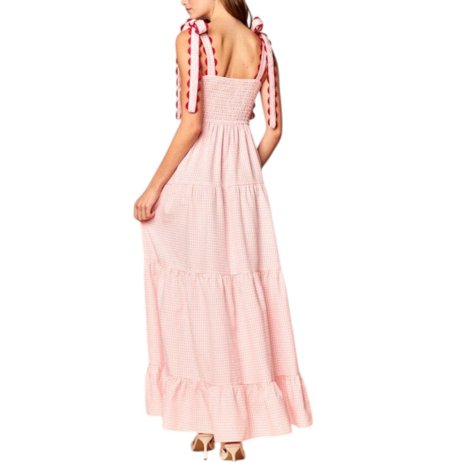 Pink dress with ribbon straps on a white background