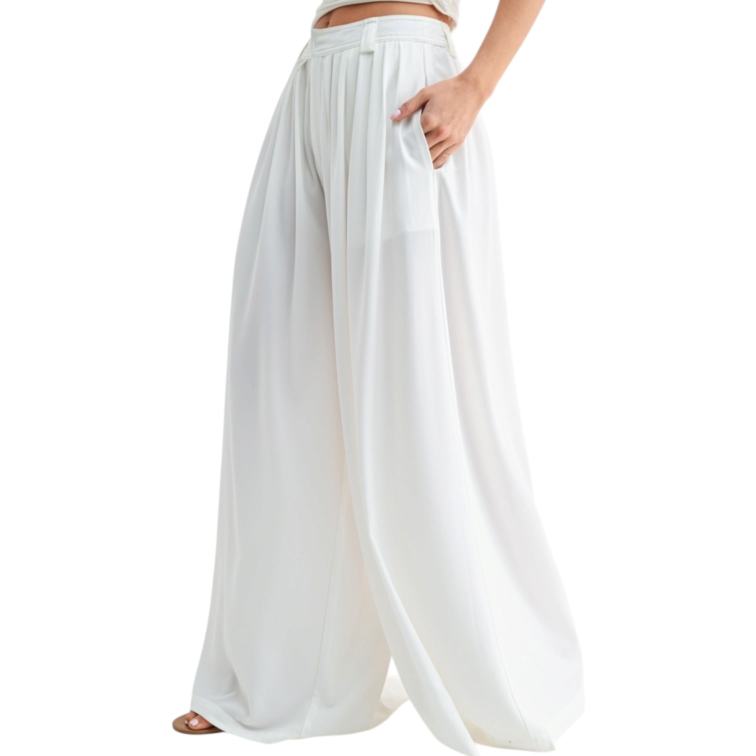 White wide-leg pants worn by a person on a white background