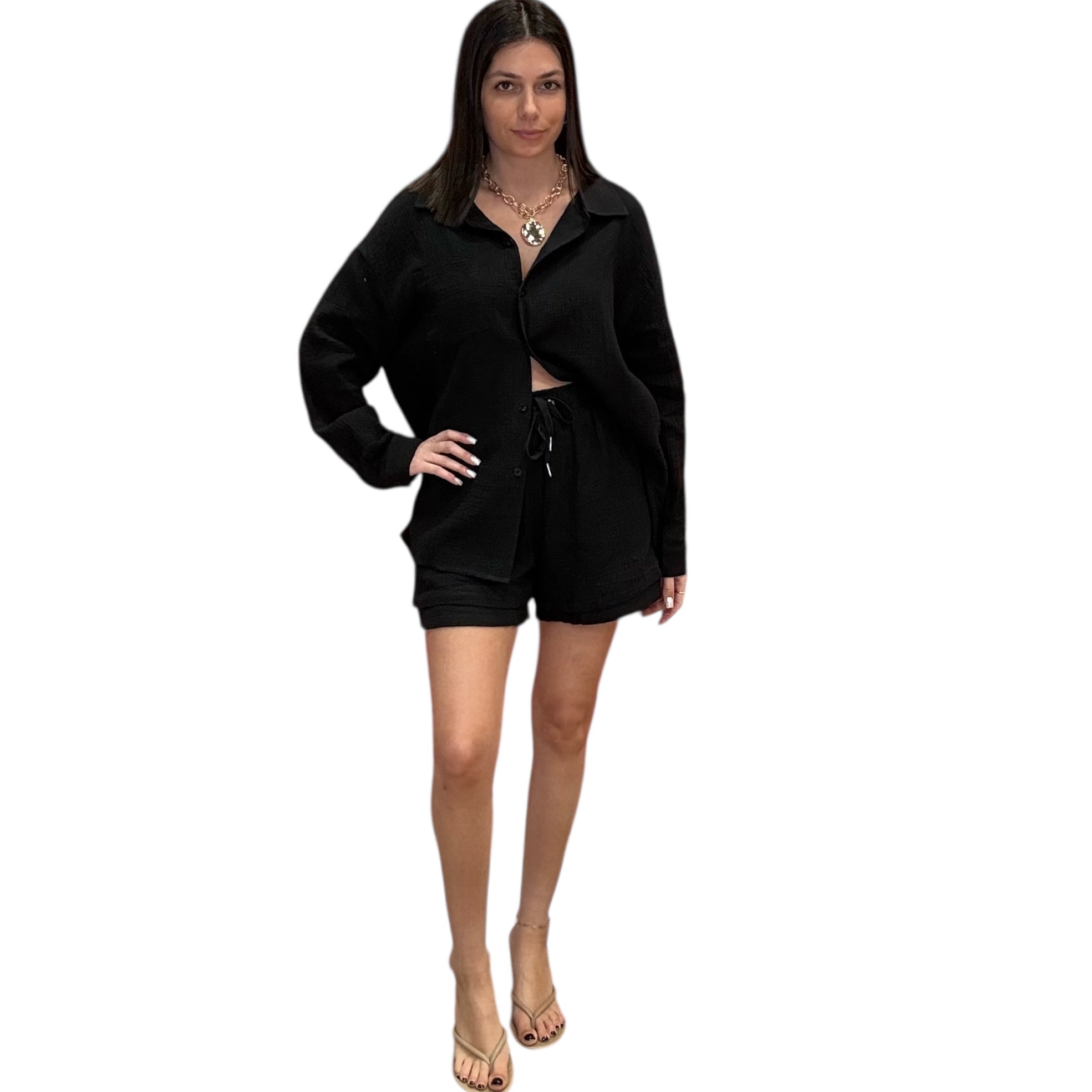 Woman wearing a black outfit on a white background