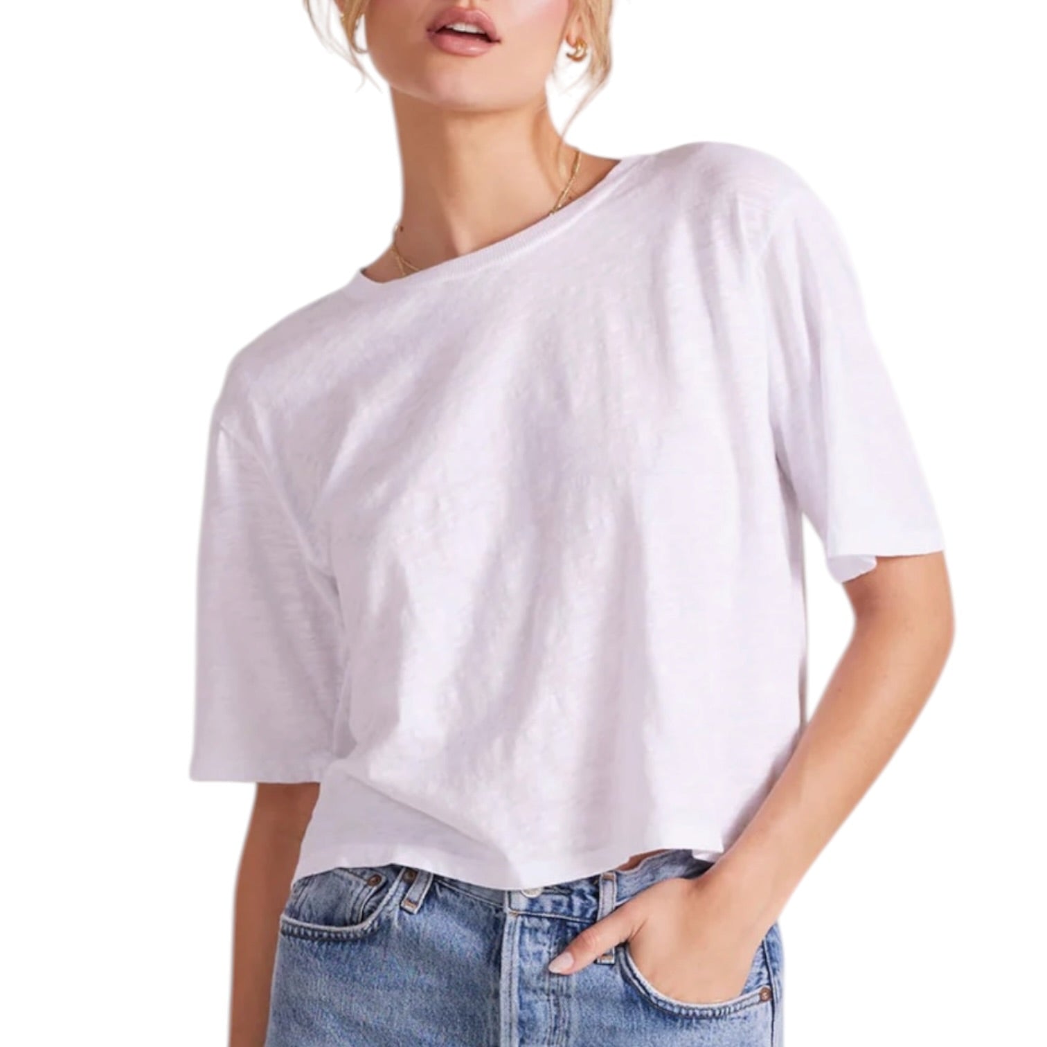 Person wearing a white t-shirt and blue jeans on a white background