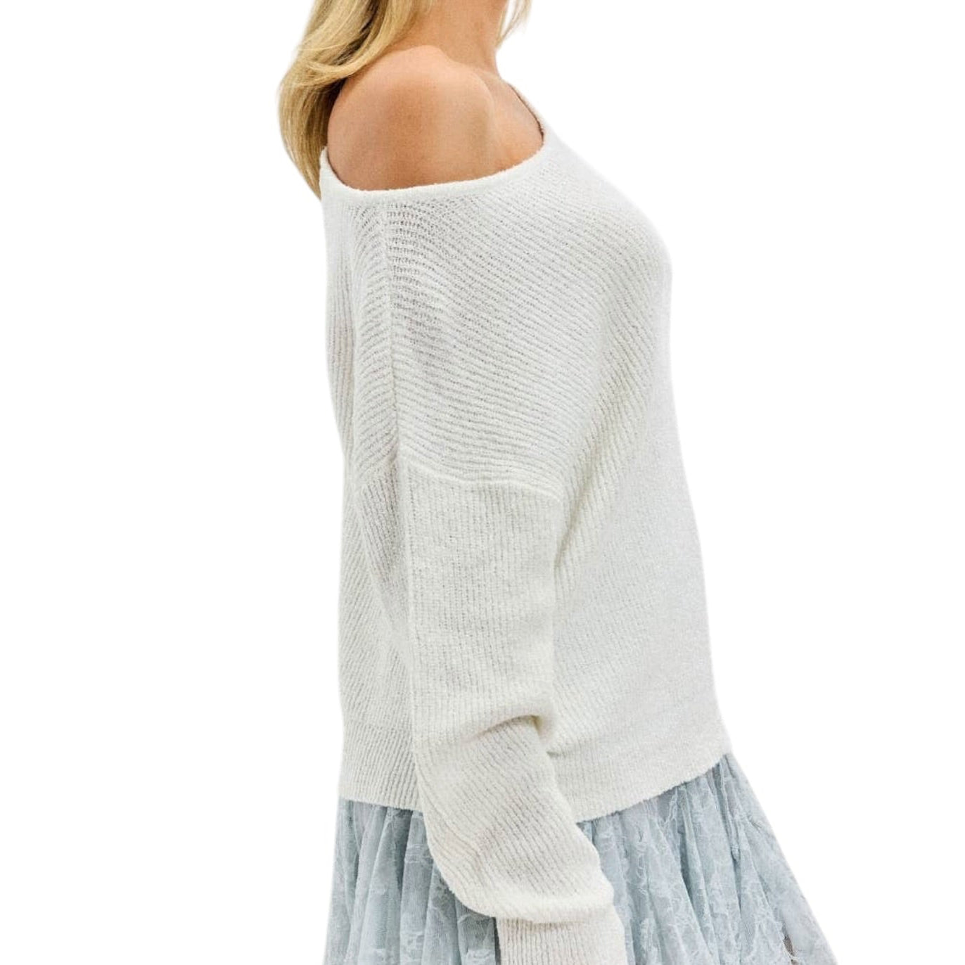 White off-shoulder sweater with a light blue ruffled skirt on a white background