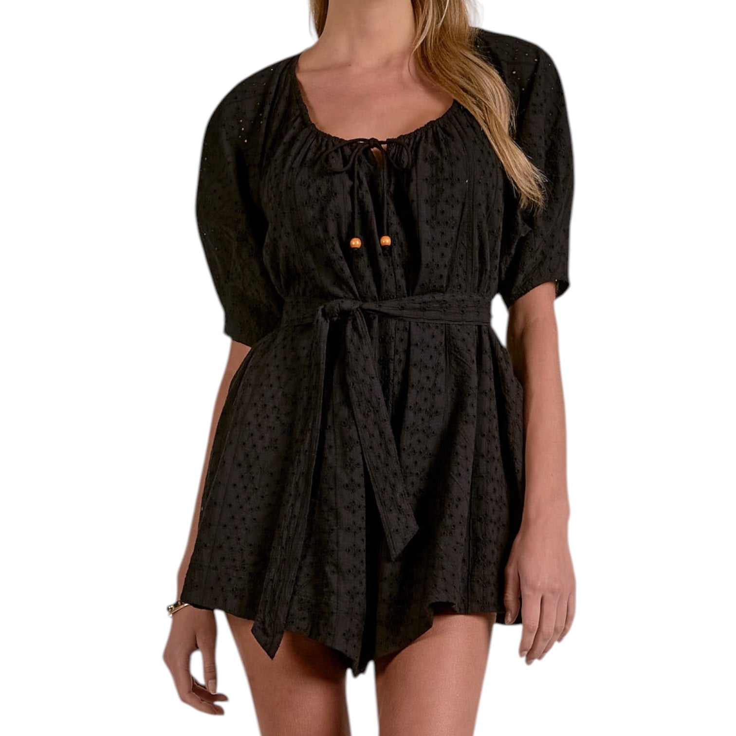 Black patterned dress worn by a model on a white background