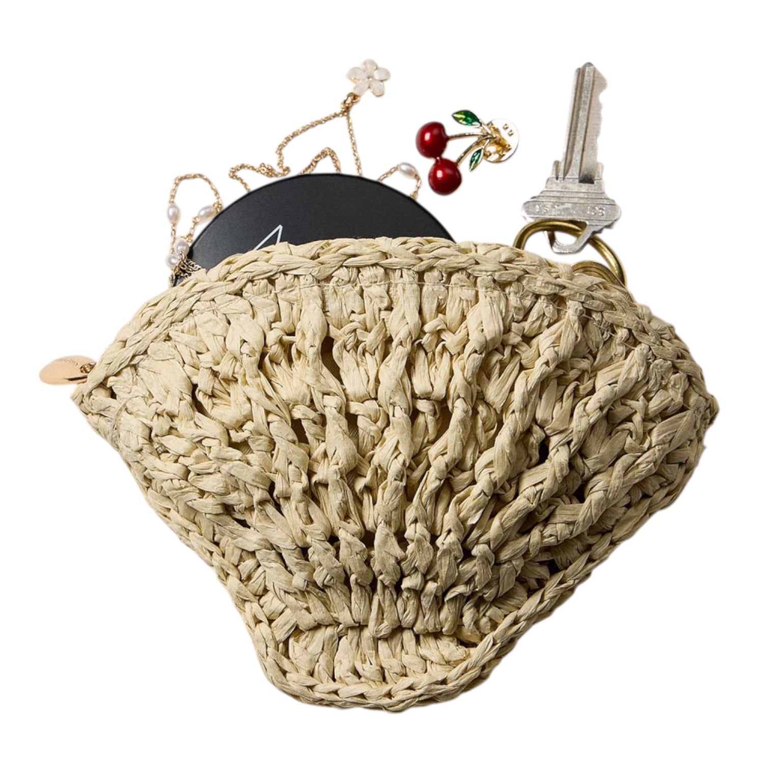 Beige woven wall hook with decorative items on a white background