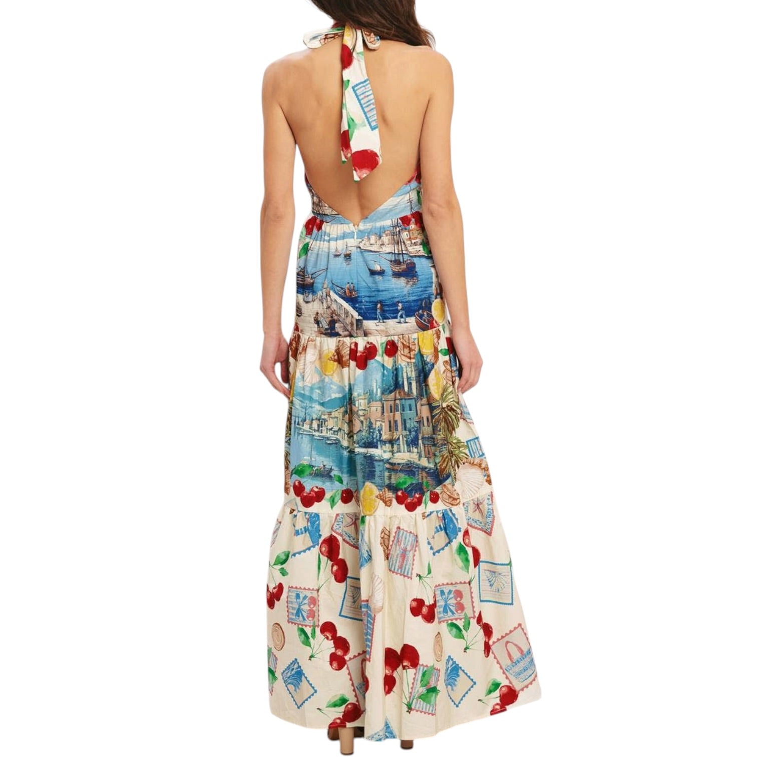 Woman wearing a colorful patterned dress with a white background