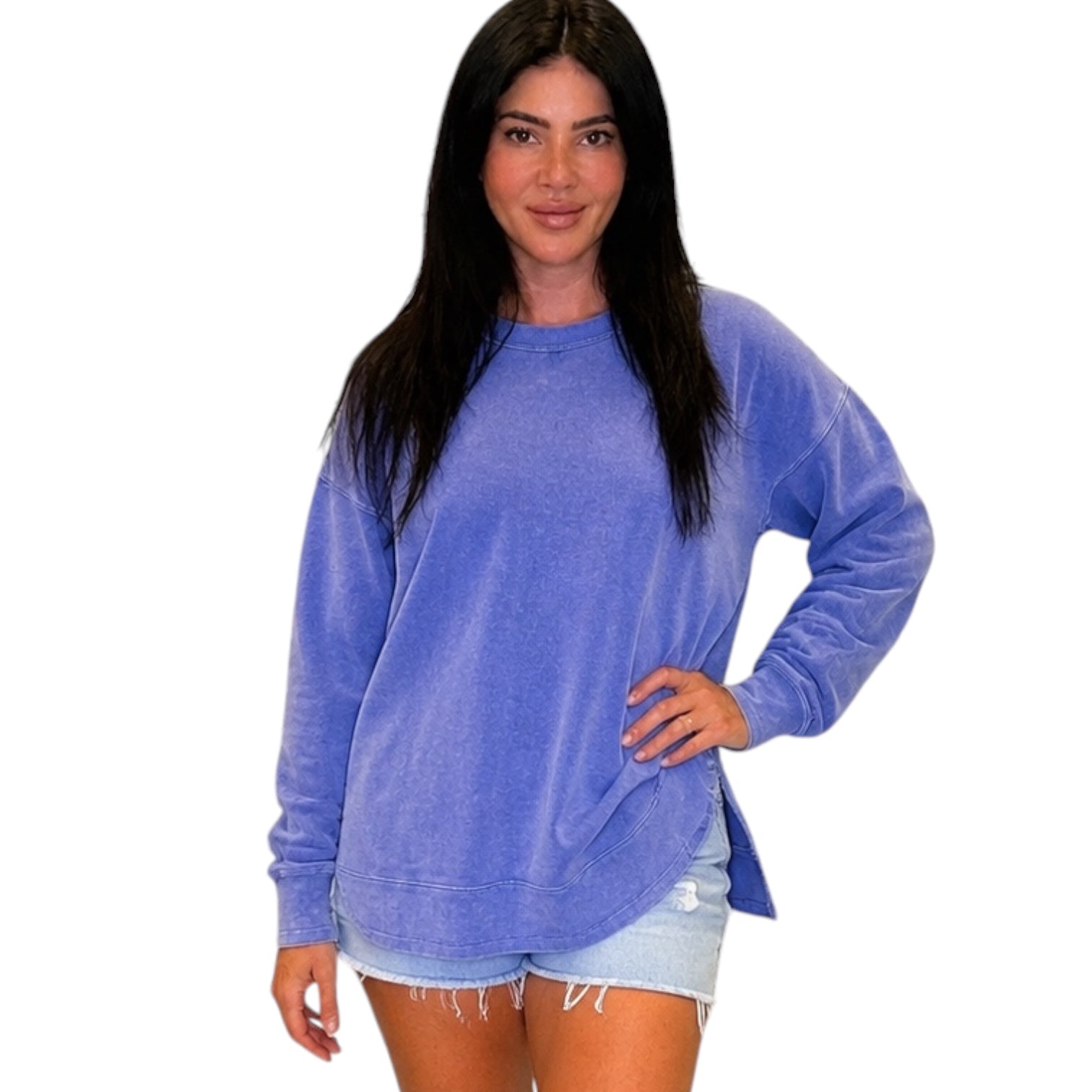 Woman wearing a blue sweatshirt on a white background