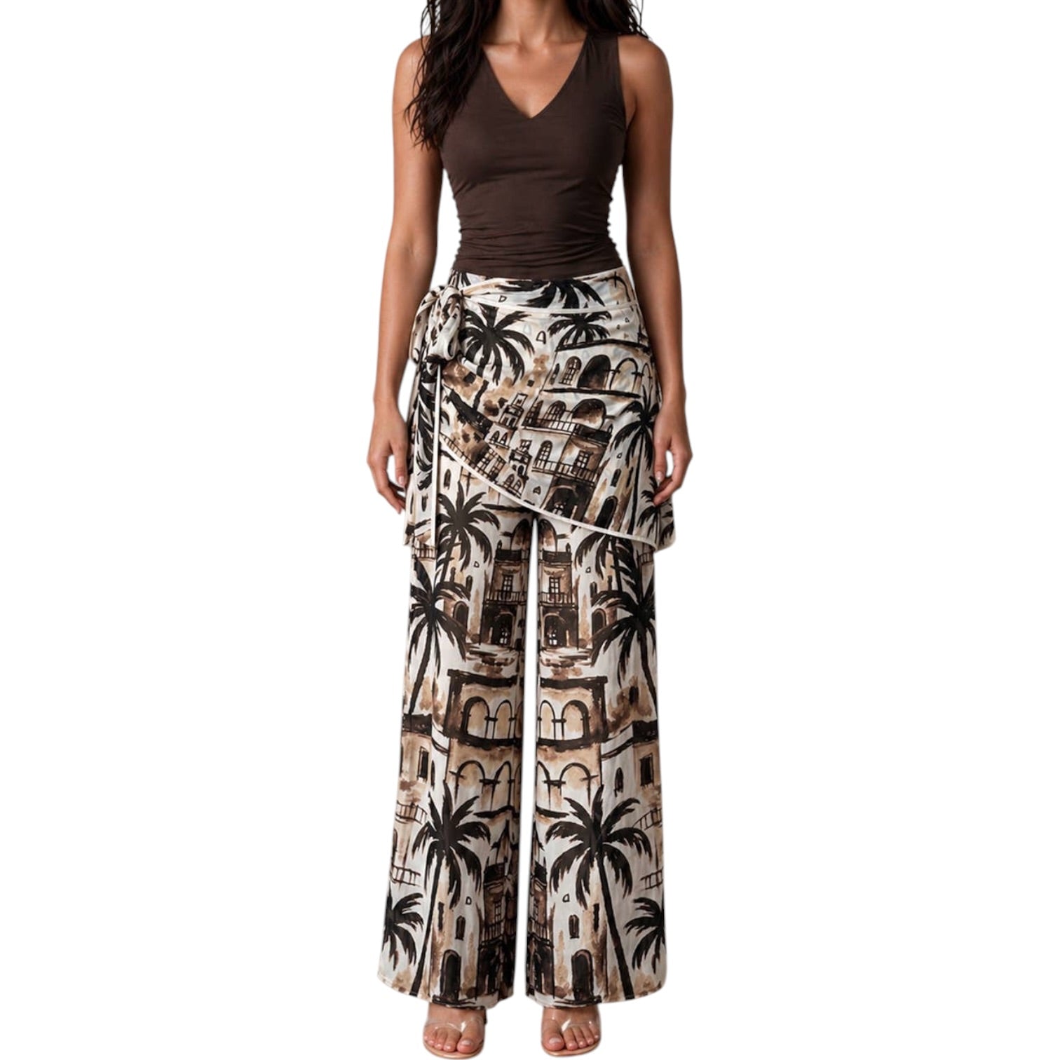 Woman wearing a sleeveless top and patterned wide-leg pants on a white background