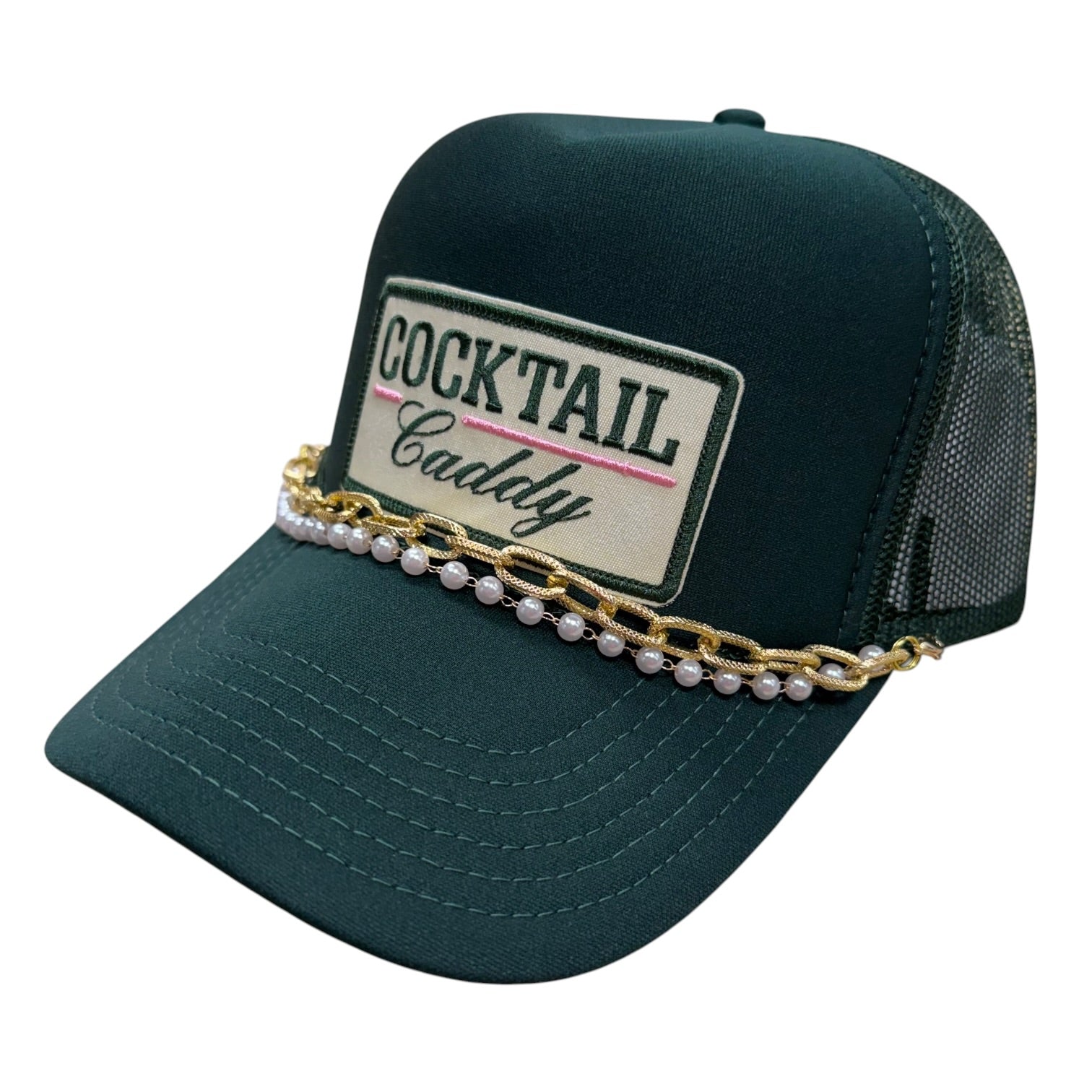 Green cap with 'Cocktail Caddy' patch and pearl embellishments on a white background
