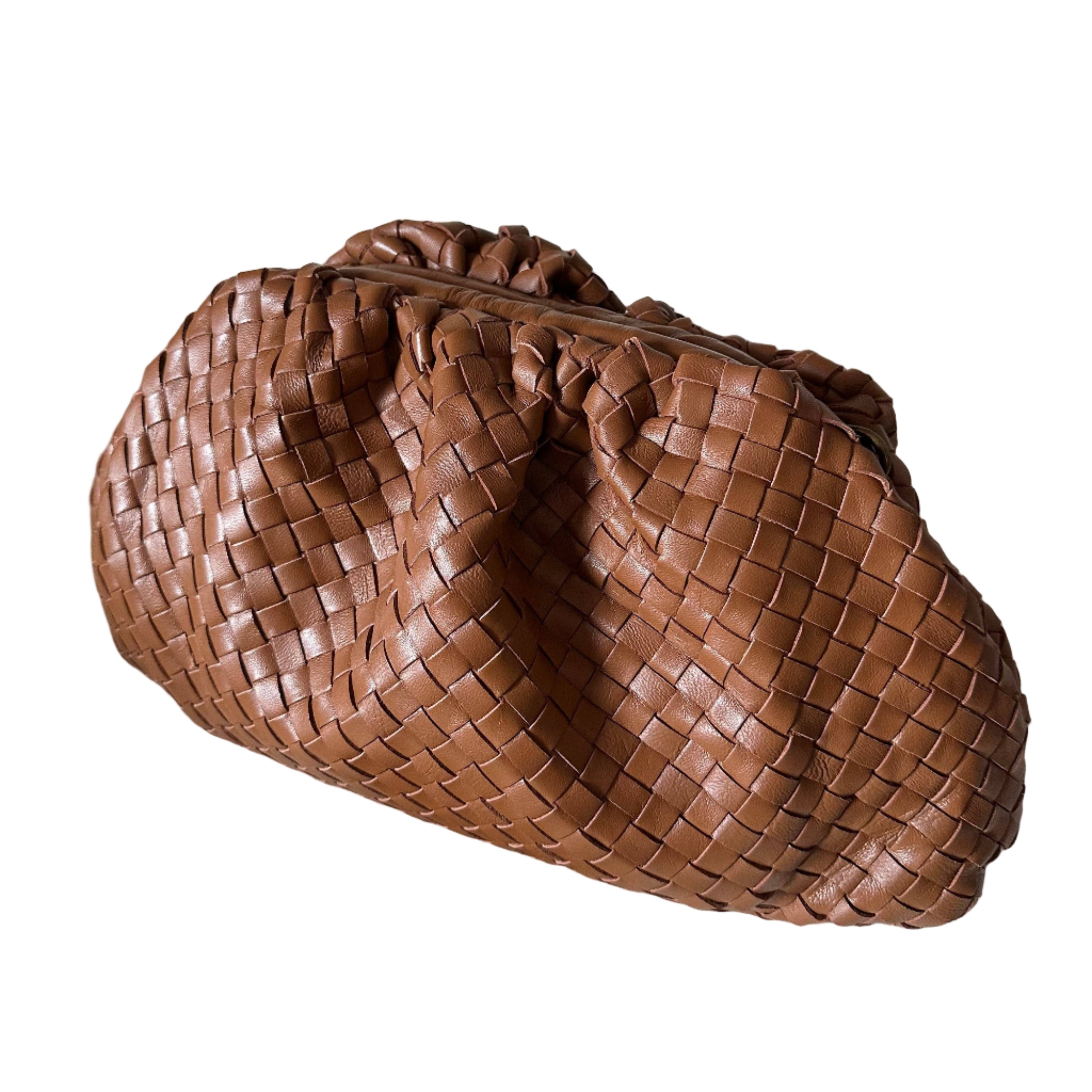 Cognac woven handbag on a white background
