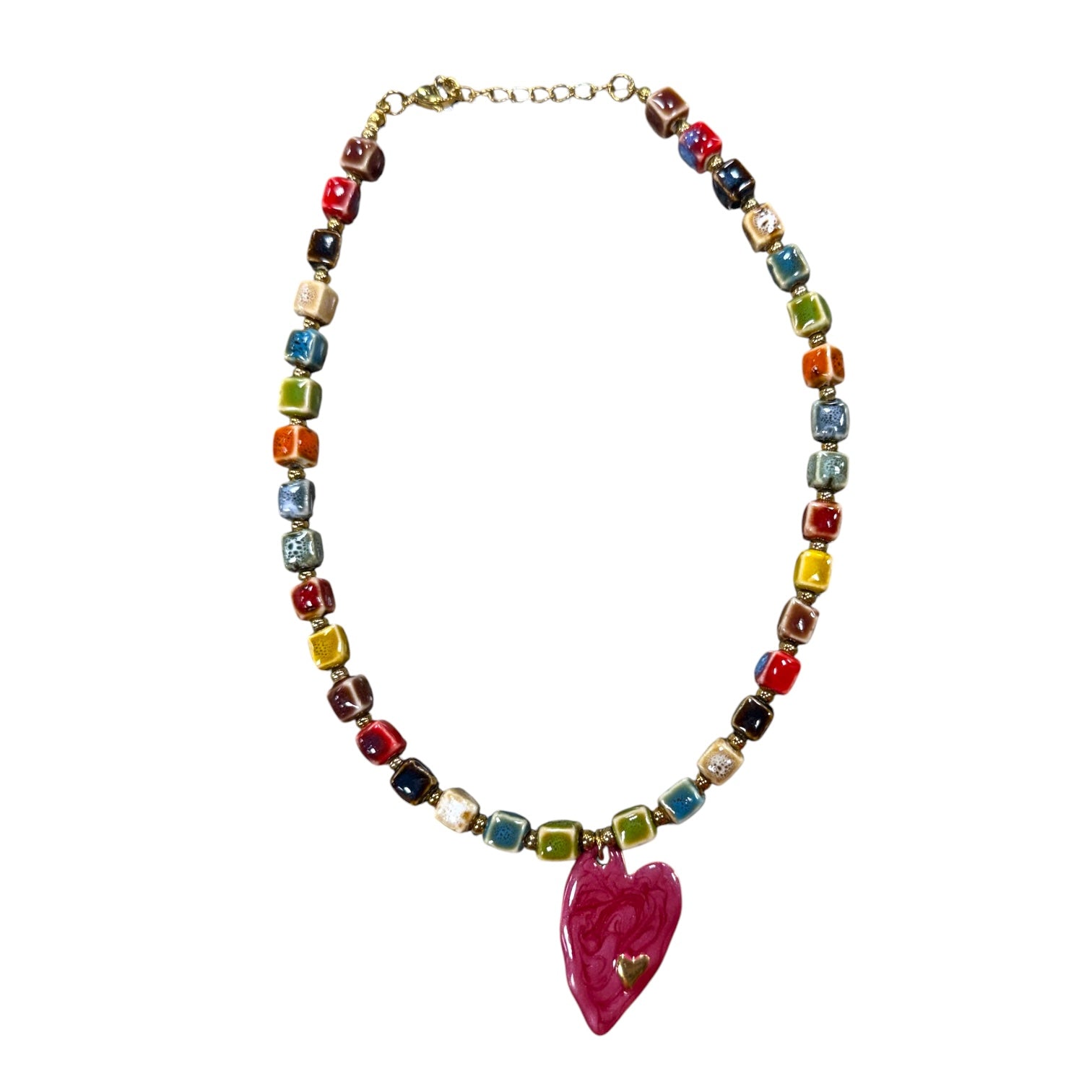 Colorful beaded necklace with a pink heart pendant on a white background