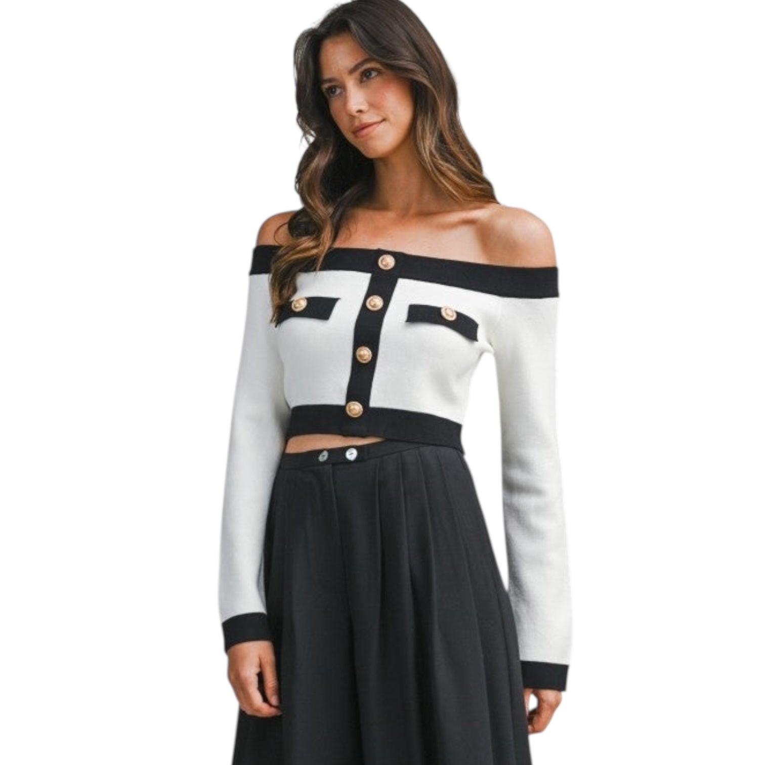 Woman wearing a black and white off-shoulder top with long sleeves on a white background